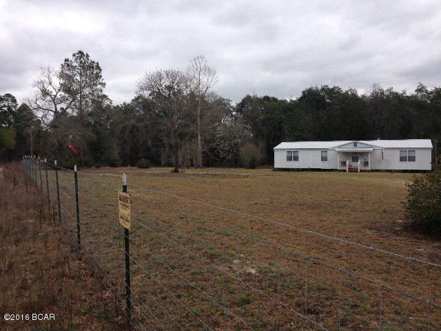 Just under 4 acres, this nice Double-Wide Mobile Home home comes with remodeled, furnished and is completely renovated. Also has new metal roof, plumbing, electric, appliances, etc, refurbished water pump/ well (good clear water), septic system, and is newly fenced. Land is approximately half wooded and half cleared, with about 650 linear feet frontage on Chason Road. Fifteen minutes from Super Walmart, Lowes, Shopping Center, Motels, Gas Stations & Hospital. Owner also mentions land swap as a possibility. Call today for your appointment!!