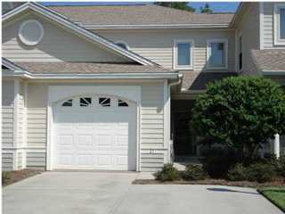 Upscale gated townhouse community close to beaches, 23rd St. and St Andrews. This three bedroom townhome has arched foyer entry with tiled floors crown molding throughout the first floor and a tray ceiling in the living room. The kitchen is both elegant and practical with beautiful wood cabinetry, granite and Corian counters and tiled floors. Master bedroom is on first floor with small sitting area with a patio door overlooking the back patio and lake. The master bath includes two large closets, Whirlpool tub, a separate bright tiled walk in shower and two vanities. Upstairs family room and two bedrooms with bath for separate living. One car garage, large inside laundry room, half a bath, lots of storage. View of the lake. This is a must see. Lawncare included.