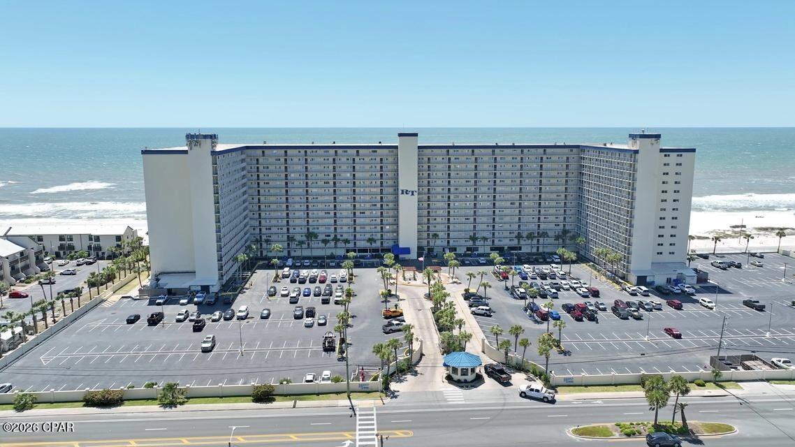 Welcome to paradise at Regency Towers 121! This coveted first-floor condo offers the ultimate in beachfront living, with direct access to the courtyard area just steps from the pool, tiki bar, and grill. And with the sugar-white sands and emerald-green waters of the Gulf of Mexico just a few more steps away, you'll be living the coastal lifestyle you've always dreamed of. Inside, you'll find three full bedrooms and two full bathrooms, providing plenty of space for family and guests to relax and unwind. A full-size washer and dryer inside the condo make laundry a breeze, while the fully updated kitchen boasts stainless appliances and quartz counters, perfect for preparing meals and entertaining. The master bedroom and family room feature a closed-in patio overlooking the Gulf, where you can enjoy stunning sunsets and gentle sea breezes year-round. And with Regency Towers' amenities including multiple pools, a tiki bar and grill, beach chair rentals, beach bonfire rental, and beachside jet ski rentals, there's never a dull moment. After a day in the sun, indulge in the culinary delights of over 15 restaurants within a short distance of your doorstep. Whether you're craving fresh seafood, international cuisine, or classic comfort food, you'll find it all just moments away. Don't miss your chance to experience the best of beachfront living at Regency Towers 121. Unique opportunity to have all the benefits of Gulf Front, Coastal life and the first floor convenience, no elevator needed! Come visit today and start living your coastal dream!