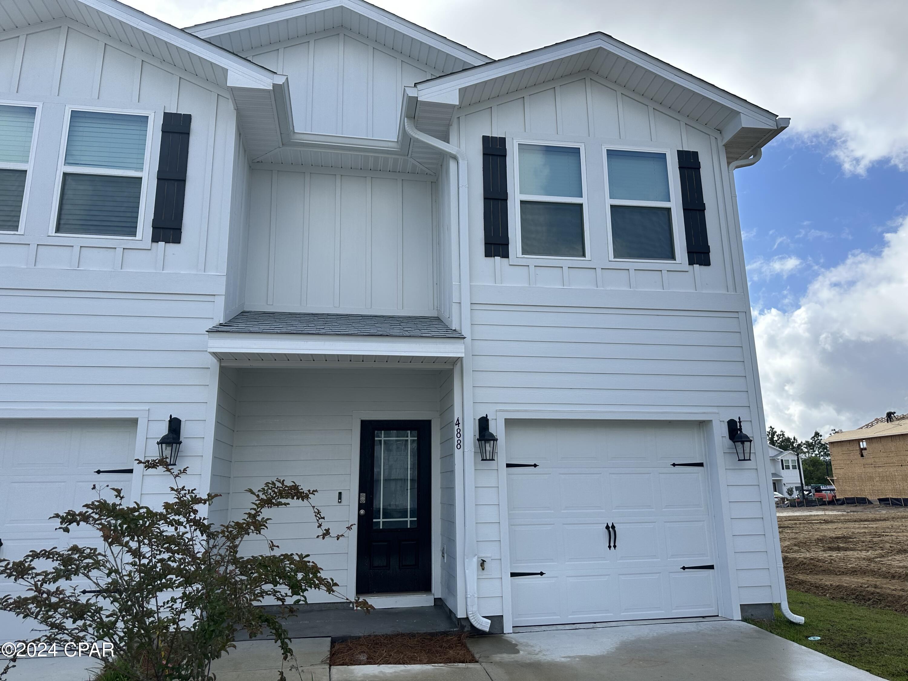 Constructed in 2023 this townhome has been well taken care of and shows like new! Proximity to the beach, airport, shopping and dining makes this the perfect location. The first floor is open with ample room in the living area. The kitchen has a new refrigerator, pantry, and kitchen island. Upstairs is well designed with all three bedrooms and a laundry closet. The primary bedroom is spacious with a walk-in closet and dual vanity bathroom.