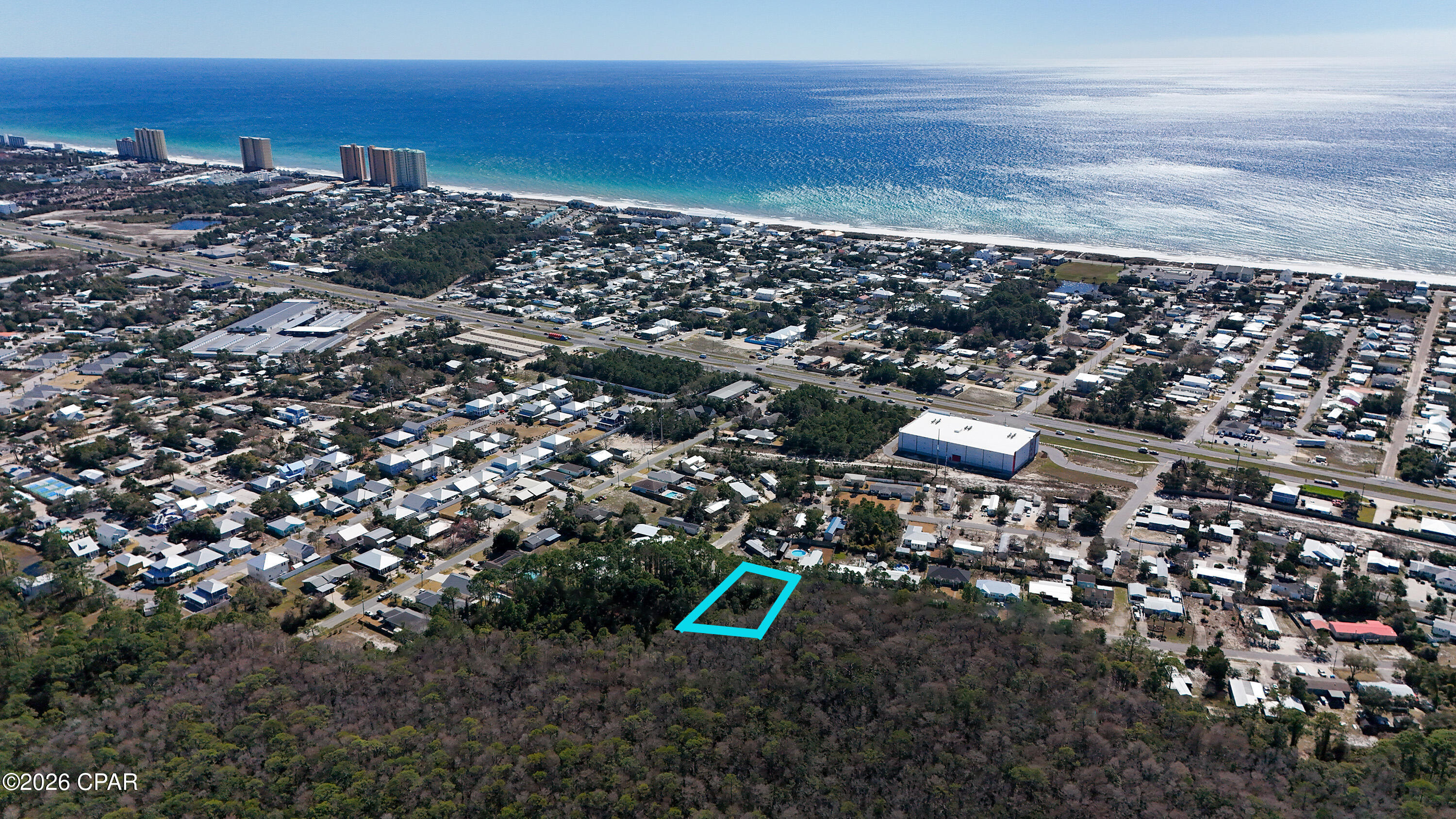 Less than one mile from the pristine white sandy beaches of Panama City Beach, this vacant land offers an exceptional opportunity for builders, developers, or investors seeking a coastal location with strong upside. This quarter of an acre parcel provides ample space for a small multi-family, townhome, or residential development in an area experiencing continued growth and demand.

The property features paved road access with public water and sewer available at the street and is zoned R-2, allowing for single family & multi-family.

Need more land? Additional adjoining Malaga parcels are available, allowing for a combined assemblage of approximately 3.7± acres for a larger development footprint or long-term investment strategy.

The property's proximity to Panama City Beach's sandy shores, less than one mile away, ensures that residents will enjoy the ultimate beach lifestyle, with sun, surf, and relaxation just a short stroll from their doorstep.

Panama City Beach consistently ranks as one of Florida's top tourist destinations, offering investors the potential for significant rental income and long-term appreciation.