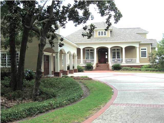 RARE OPPORTUNITY! Custom built home on St. Andrews Bay in the Cove. This 3 bedroom/3.5 bath with home with an office plus carriage house with 2 bedroom/1.5 bath is one of a kind! The main house features over 4,500 SF of beautiful craftsmanship design. The views overlooking St. Andrews Bay from the first step in the front door continue through the Formal Living Room, Den, Kitchen, and Breakfast Area. The Master bedroom walking into the Master bath features a closet of no comparison. Another master bedroom, additional bedroom, den with wet bar, and storage/workout room is easily accessible upstairs via the elevator. The carriage house features a two car garage, half bath downstairs, and a living area, kitchen, 2 bedrooms, and a full bath upstairs.