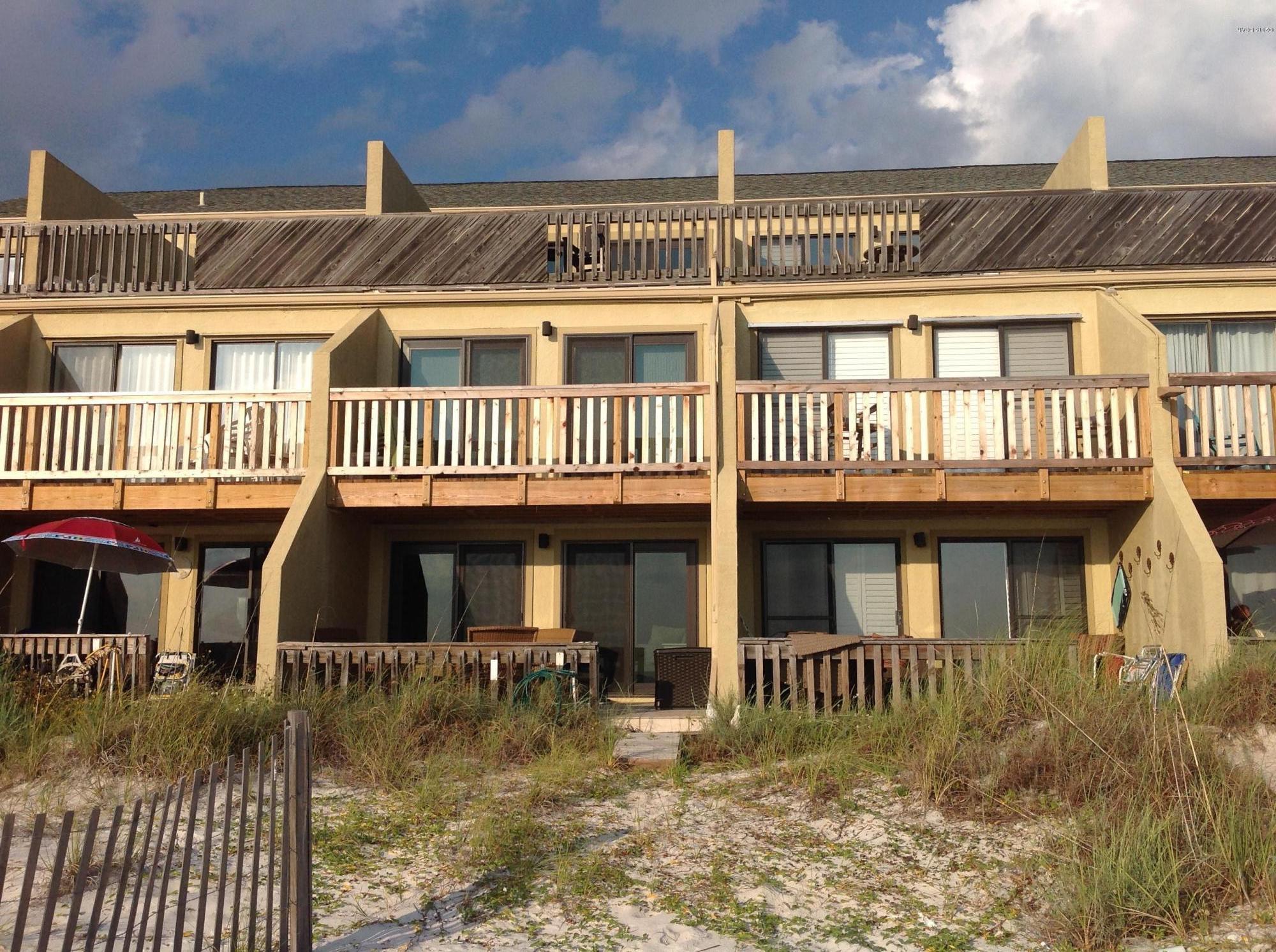 OPEN HOUSE 12/6/15 Gulf front Townhouse on the White Sandy Beaches.  This updated/renovated 3 level condo has all the extras and boast patio and balconies off of each level.  This 3 bedroom 3 bath townhouse has granite, updated tile, new interior and exterior doors, glass tile, floor to ceiling views of the Emerald Green Beaches. The kitchen has stainless appliances, a kitchen island, tons of cabinets, a pantry, double oven, and updated cabinets and lighting.  Two bedrooms have a gorgeous jack and jill bathroom, and one of the bedrooms is gulf front with its own large balcony.  And Finally the 3rd floor is the master suite with a fabulous bath fit for a king/queen.  This is a must see with all of the common amenities on the grounds AND a gated community.  A rare find and never been rented