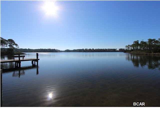 If you're thinking about building your dream home then you're in luck - a beautiful waterfront lot in the gated community of Laird Bayou is now available and flood insurance is not required. Laird Bayou boasts a peaceful, scenic, natural environment with deep water access to East Bay and the Gulf of Mexico from the community boat launch as well as a dock, community pool and fenced storage area for boats/RV's. This is one of the largest lots available with 1.4 acres and it's recently been bush hogged and remember no flood insurance is required. So don't delay call your agent to view this quiet preserve like neighborhood that's convenient to Tyndall AFB, Eastern Ship Building and all the amenities of town.