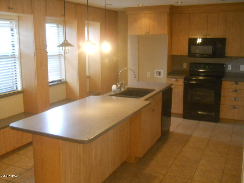 This Canal Front home has it all- 3 bedrooms, 2 baths,inground pool,large wood burning fireplace, french doors from the master to pool area, private patio, covered deck, wood floors in living area, ceramic tile in kitchen and baths and carpet in bedrooms.  Property consists of a huge lot with lots of frontage at the convergence of two canals.  This lovely home is located  in a quiet, established neighborhood and a centrally located area of Panama City and convenient to shopping, schools, and entertainment that Panama City has to offer.  This is a Fannie Mae HomePath property. All information is taken from public records. If important to buyer, please verify.