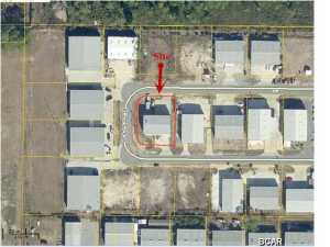 6252 sq. ft. warehouse close to Navy base that features finished office and display area with 2 rest rooms and a 1049 sq.ft. kitchen space. Building located on .32 of a acre with 3 phase power, three a/c units and a 12' 2700 sq. ft. open drive through bay that has two electric roll doors. The top portion of the mezzanine is 2500 sq.ft with poured concrete floor that is insulated with spray foam and has a/c ducted to it. The bottom portion has 10' ceiling open span area. Located on Holley Circle has plenty of parking that gives you access to three sides of the buiding. Built in 2006. This is a great buisness opportunity.