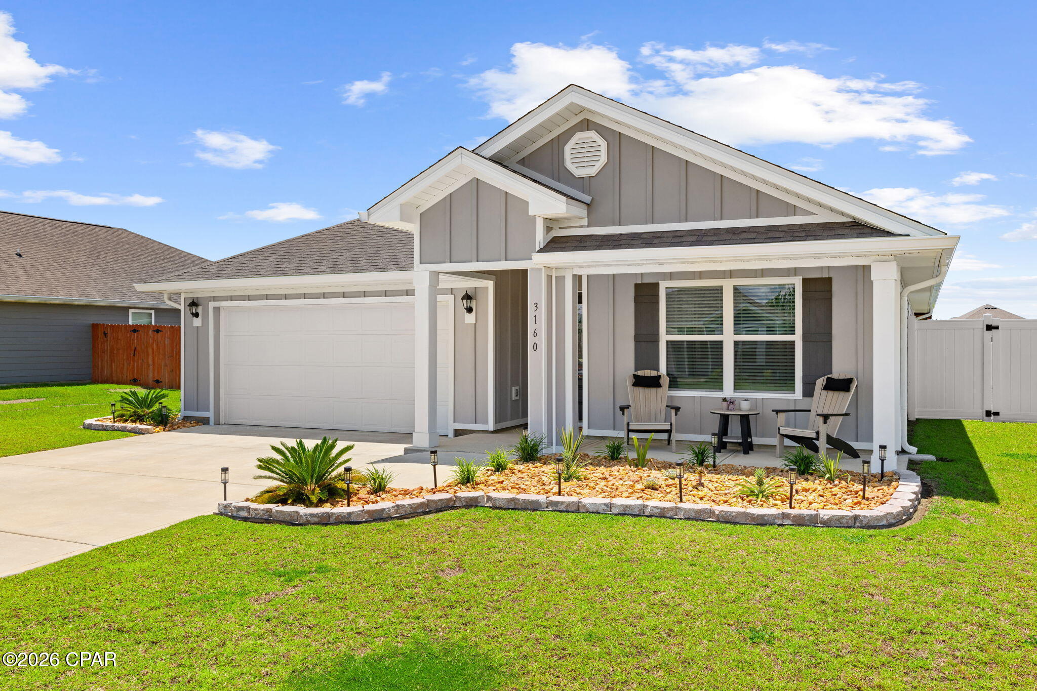 Welcome to this beautifully upgraded 2024-built home in the desirable Hodges Bayou community, where modern construction meets thoughtful owner-added improvements that truly set this property apart. Offering 4 bedrooms, 2 bathrooms, and an inviting open-concept floor plan, this move-in-ready home features granite countertops, a large center island, abundant cabinetry, a spacious walk-in pantry, and an open living and dining area designed for both everyday living and entertaining. Unlike many new construction homes, this property already includes numerous upgrades, including updated light fixtures, ceiling fans throughout, professional landscaping, gutters, a white vinyl privacy fence, epoxy-coated garage floors, a custom garage wall storage system, an extended concrete patio, a beautiful wood pergola, and a storage shed situated on its own concrete slab. The spacious primary suite offers dual vanities, a soaking tub, separate shower, and a generous walk-in closet, while three additional bedrooms provide flexibility for guests, a home office, fitness space, hobbies, or other uses. Step outside to enjoy peaceful pond views and stunning sunset views across the water from the thoughtfully designed backyard, creating the perfect setting for relaxing or entertaining. Conveniently located in the sought-after Hodges Bayou area, this home offers easy access to shopping, dining, schools, Tyndall Air Force Base, Northwest Florida Beaches International Airport (ECP), and the sugar-white sand beaches of Panama City Beach along Florida's Emerald Coast. Better than new, this home offers the peace of mind of newer construction with the convenience of owner-added improvements already in place.