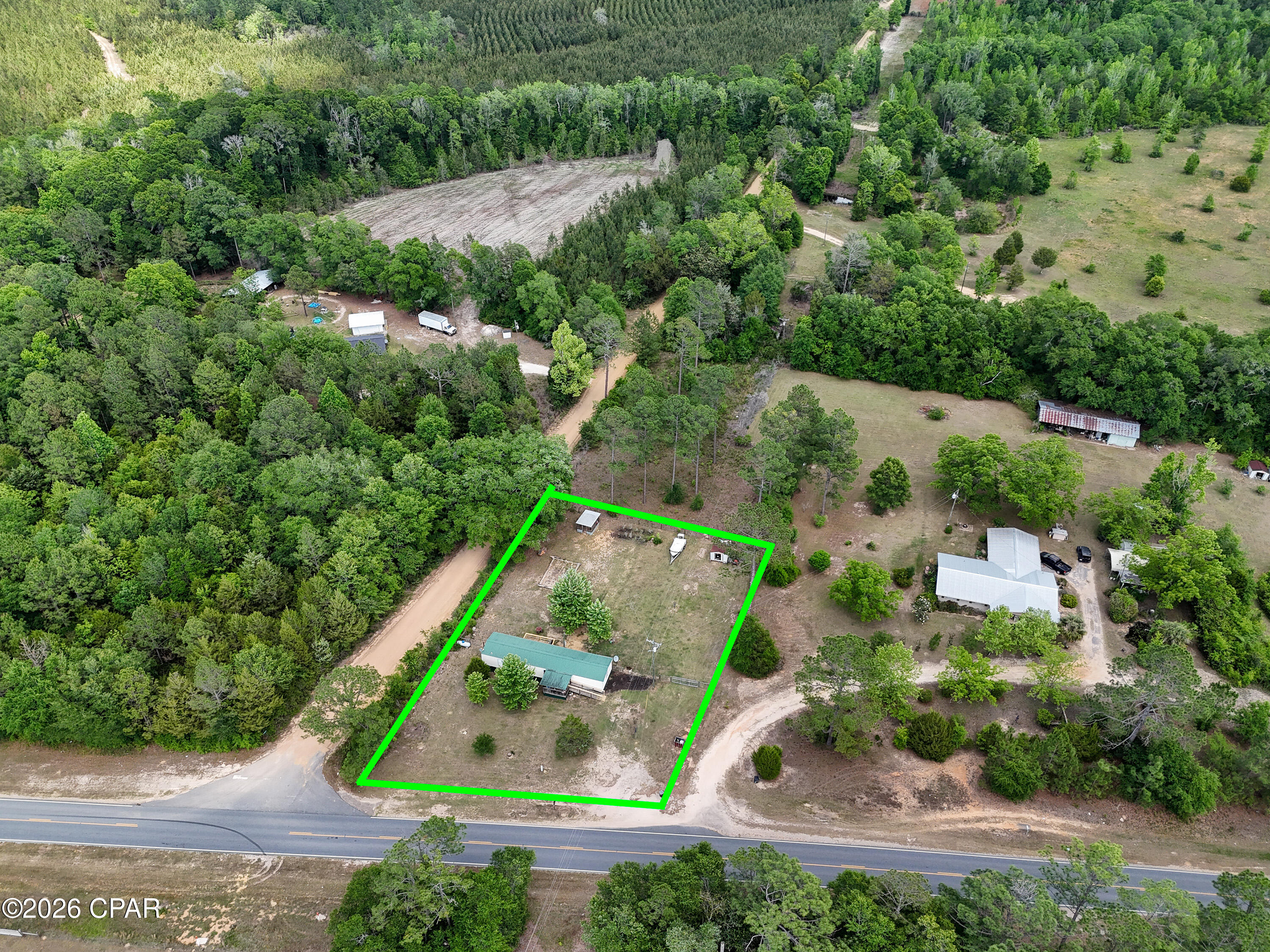 Affordable country living in Bonifay. This mobile home sits on .71 acres, fully fenced, offering privacy and room to spread out. Recent upgrades include a mini-split system installed in 2025 for added comfort and a new back porch/deck for outdoor use. Property allows chickens and has propane in place. Quiet setting with plenty of space, all at a price point that's hard to beat.