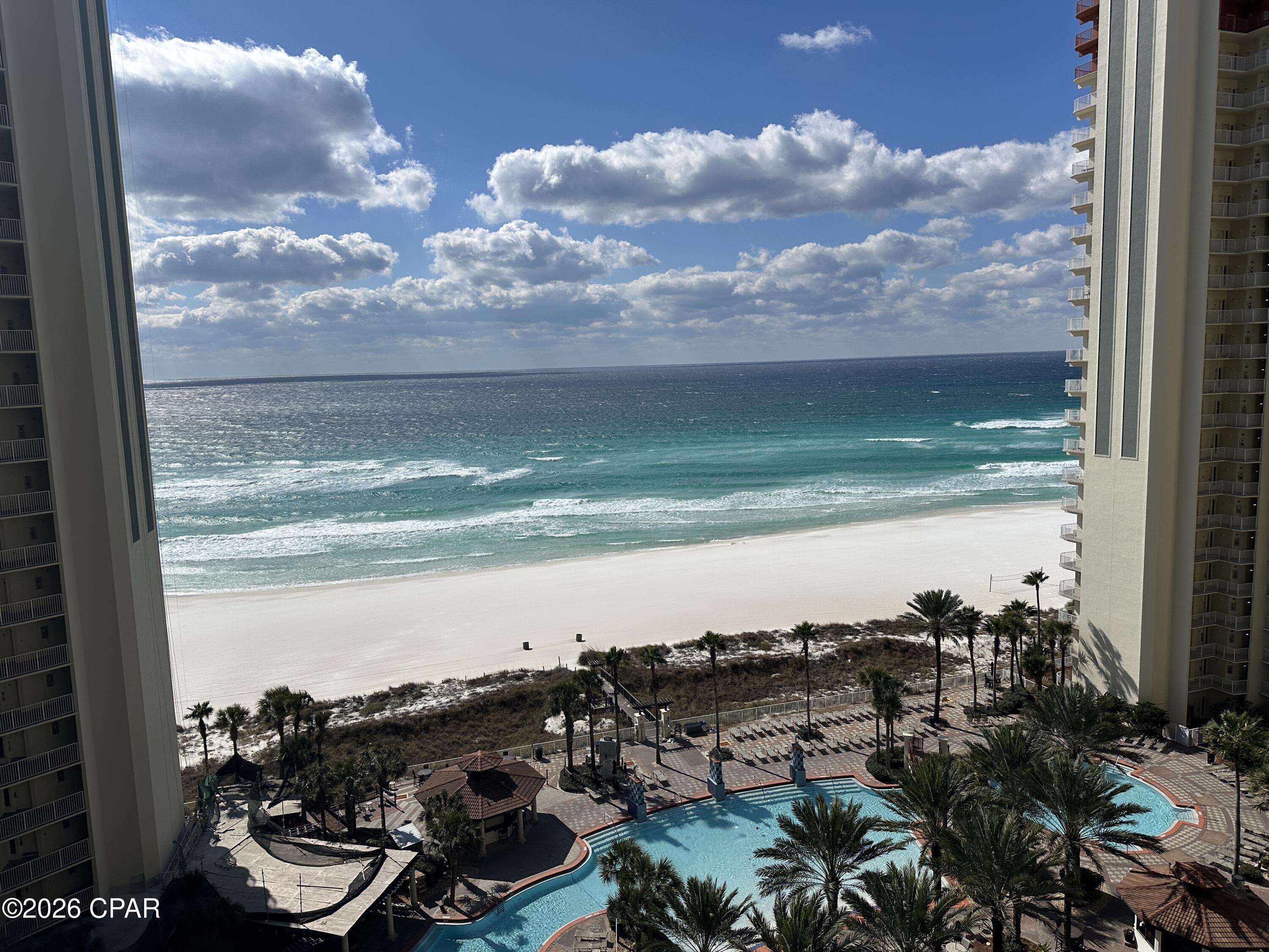 Welcome to the 12th floor at Shores of Panama, where Gulf-front views and strong rental potential come together in this 2-bedroom + bunk room, 3-bath condo that comfortably sleeps up to 8 guests. This condo is perfectly positioned to capture spectacular western-facing sunsets over the Gulf. From your spacious private balcony, enjoy panoramic views of the emerald waters and the resort's iconic lagoon-style pool.

The thoughtfully designed floor plan features two king suites, each with its own ensuite bath, offering privacy and comfort for owners and guests alike. A bunk area with twin beds and a queen sleeper sofa in the living area maximize occupancy and rental appeal.

Inside, the open-concept layout creates a welcoming retreat. The fully equipped kitchen includes granite countertops, and a breakfast bar that flows seamlessly into the dining and living areas--ideal for entertaining or relaxing after a day on the beach. 

This unit conveys with a deeded parking space and is rental-ready, making it an outstanding option for investors or buyers seeking a turnkey Gulf-front getaway. The condo conveys fully furnished and rental-ready, making it an effortless investment opportunity or turnkey beach retreat. This unit also includes one deeded parking space. 
Shores of Panama is home to the largest Gulf-front lagoon pool in Panama City Beach, with its spectacular 14,000+ sq ft zero-entry lagoon pool with palm-lined islands, fountains, and expansive hot tub. tropical palm islands, fountains, and an oversized hot tub--all just steps from exclusive beachfront access. Owners and guests also enjoy:  Indoor heated pool and hot tub, 24-hour fitness center, Seasonal poolside Tiki bar, Covered parking, and On-site security.
The location is unbeatable--walk next door to Pineapple Willy's for beachfront dining or cross the street to Laketown Wharf for multiple dining options including The Wharf Buffet, Juan Taco, and LuLu's Bar & Restaurant. Shopping, entertainment, and attractions are all within easy reach.
If you're looking for a well-positioned Gulf-front condo with proven rental appeal and unbeatable amenities--this is a standout opportunity. With exterior renovations scheduled to enhance curb appeal and long-term value, this is a strategic opportunity to secure this wonderful gulf front condo--ideal as a personal retreat, income powerhouse, or both. All information and HOA details are believed accurate but should be verified by buyers if important.