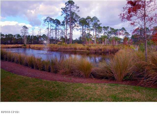 Lake-front lot in Martinique! Lot 59 has a western-facing rear view which will set the stage for beautiful sunsets from your back porch. The natural walking trail along the lake will easily connect you to the community pool & kid's playground.   Wild deer & ducks frequent Martinique and add to the natural serenity this location provides. Martinique is close to ammenities & less than 10min. to the beach. All sizes taken from appraiser site, please verify.