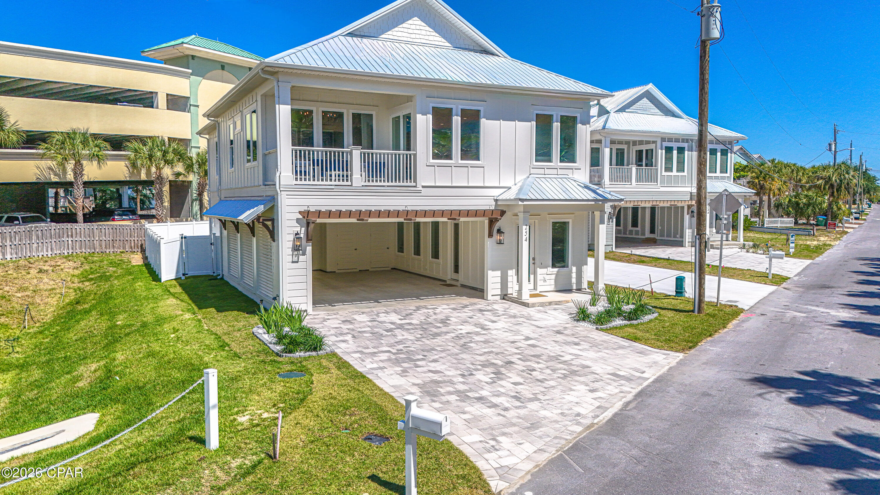 Construction of this beautiful Coastal Retreat is completed! Great Short -Term Rental Projection of $178,000 annually. Discover this wonderfully crafted luxury home. Located on the highly desirable West End of Panama City Beach--just steps from the Gulf's most beautiful beaches. This residence offers both a serene retreat and exceptional income-producing potential. With 5-bedrooms and 4.5-bathrooms the home spans two stories with parking for 6 vehicles and designed for both comfort and sophistication. The chef's kitchen is a true showpiece, featuring upgraded stainless-steel appliances, including a French-door refrigerator, gas cooktop, dishwasher and wall oven/microwave combination. Custom 42'' white shaker cabinetry, quartz countertops, and a spacious walk-in pantry complete this gourmet space. The open design flows seamlessly to outdoor living with a 12'x24' private saltwater pool, equipped with a gas heater for year-round enjoyment. Additional highlights include: • Gas tankless water heater • Hurricane-impact rated windows and doors • Durable metal roof & Hardie siding • 8' interior and exterior doors • 10' ceilings on both levels A spacious game room that offers views of the pool, with multiple living areas to provide plenty of space for entertaining. Conveniently located within walking distance to the pristine white-sand beaches, and just minutes to 30A, Pier Park shopping, dining, entertainment, and a short ride to local grocery stores, this home is the perfect blend of luxury and convenience. Whether as a private coastal escape or a high-yield vacation rental, this home presents a rare opportunity on the beautiful West end.