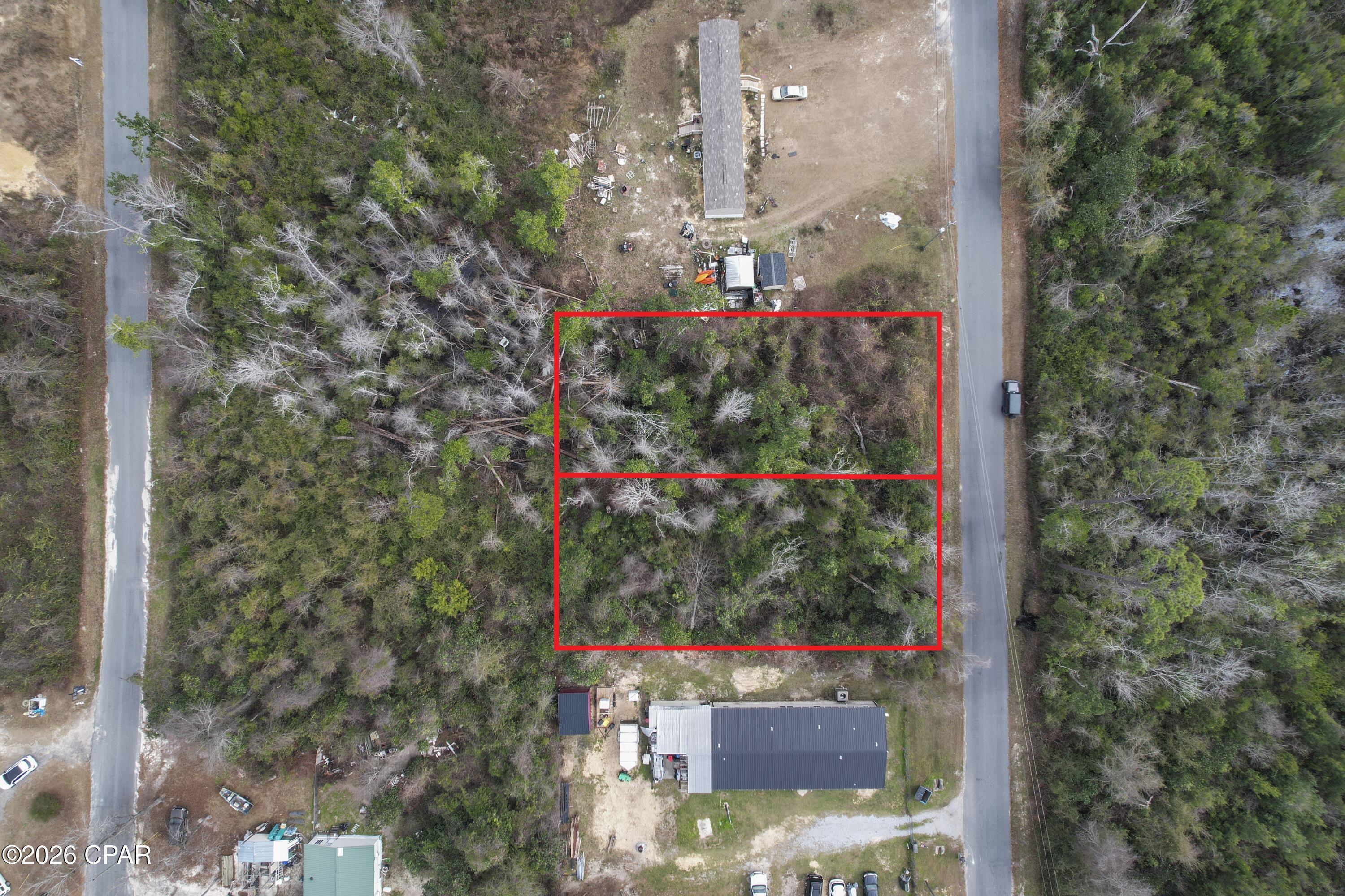 An excellent opportunity to acquire a combined 0.52 acre residential property in Youngstown, Florida, consisting of two separate parcels being sold together. This wooded homesite offers flexibility for development and is well suited for constructing a custom residence or future investment.

The setting provides a desirable blend of privacy and accessibility, with nearby access to Deer Point Lake and surrounding amenities while maintaining a quiet, residential feel. With no HOA restrictions, buyers have greater freedom to design and build according to their vision.

Whether you're a builder, investor, or future homeowner, this property presents a solid opportunity in a growing area of Bay County.