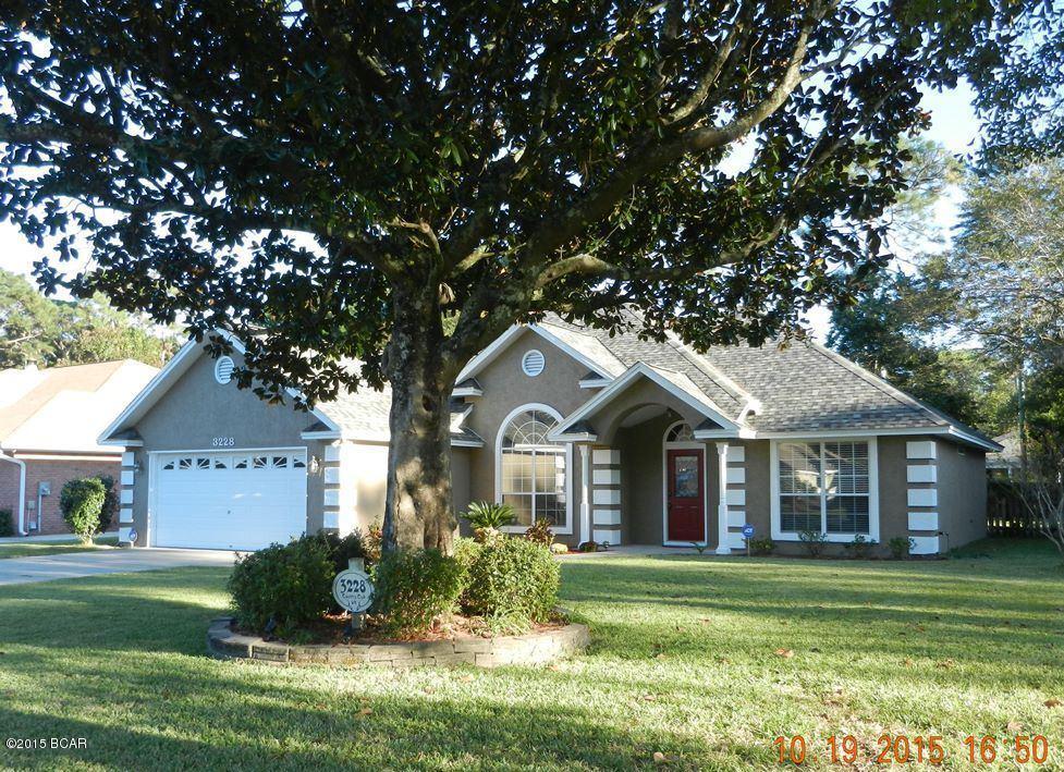 This is a well kept home in Panama Country Club.An entry way guides you into the living area of this inviting home,you will notice the beautiful wood floors,the gas fireplace.There is a separate formal dining room and the kitchen includes a breakfast nook with a Bay window, stainless steel appliances & a breakfast bar. 10 ft ceilings in living  room & kitchen,12 ft ceilings in dining room. Trey ceiling in master bedroom & the tiled master bathroom includes a stand alone walk in shower,a Jacuzzi tub,double vanity sinks & a large walk in closet.Screened in back porch,overlooks fenced yard,Exterior has been recently painted.Replacements include New roof in 2013, AC in 2010.Home also has a Termite Bond.All sizes,ages & measurements are approx.if important,please verify