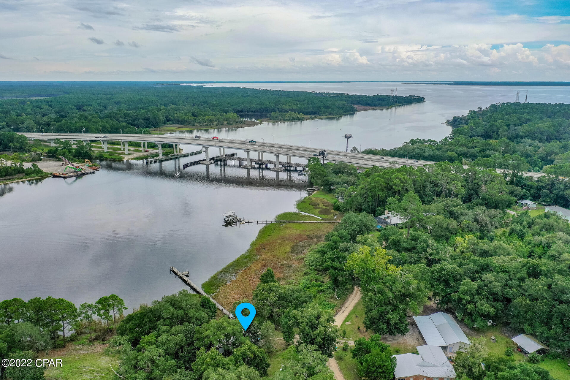 Prime waterfront lot situated on the Intercoastal Waterway in West Bay. Dock already in place. Property is on the south side of the Intercoastal and directly across from the new proposed public marina located at Latitude Margaritaville. This secluded lot has plenty of shade from beautiful mature Oak Trees. West Bay and the Hwy 79 corridor is the place to be. Minutes from with the new Latitude Margarita development, shopping, new hospital and Panama City International Airport (ECP).
