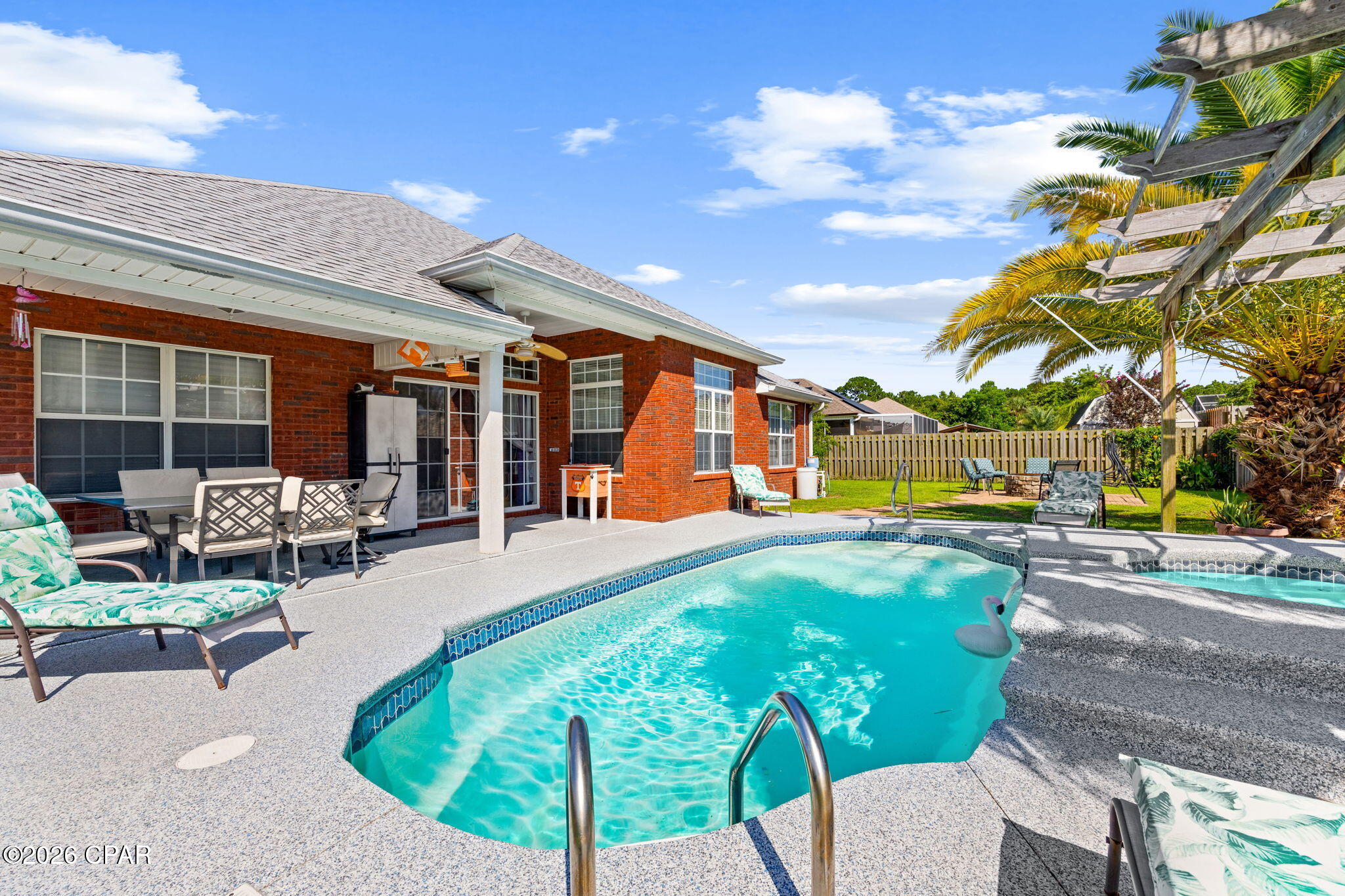 COMING SOON -No showings until July 6th. Make your reservation to see this one. Welcome to this beautifully maintained home in the highly sought-after Colony Club community, ideally located behind the Legacy Golf Course and just a short walk from the bay. Offering an inviting open floor plan, this move-in-ready residence creates a bright and welcoming atmosphere.

As you enter the spacious foyer, you'll immediately appreciate the home's airy design. To the left, the elegant formal dining room is accented by stylish lighting and a large picture window overlooking the manicured front yard, making it the perfect setting for family dinners and entertaining.

The well-appointed kitchen features stainless steel appliances, durable solid-surface countertops, a convenient breakfast bar, ceramic tile flooring, and a sunny breakfast nook overlooking the backyard. Flowing seamlessly into the expansive living room, this space is ideal for both everyday living and entertaining. The living room is complete with an electric fireplace, surround sound wiring, and plenty of room for gathering with family and friends.

The private primary suite serves as a relaxing retreat with dual walk-in closets and a spacious en-suite bath featuring double vanities, a luxurious garden tub, and a separate walk-in shower, creating a true spa-like experience.

Step outside and discover your own private backyard paradise. Designed for year-round enjoyment, the fenced backyard features a sparkling swimming pool, a soothing hot tub with a cascading waterfall, and a charming pergola, providing the perfect place to relax or entertain. Whether you're hosting guests or enjoying a quiet evening at home, this outdoor oasis is sure to impress.

Located in one of Panama City Beach's most desirable neighborhoods, with convenient access to golf, boating, shopping, dining, schools, and the world's most beautiful beaches, this exceptional home truly offers the best of Florida living.

Schedule your private showing today and experience everything 111 Twilight Bay has to offer!