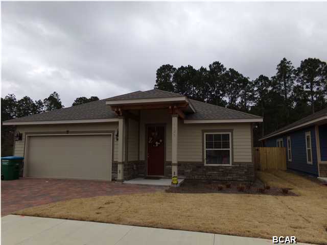 Almost New at Hidden Ridge! Corner Lot...The Fenced back yard ($3000), the separate Water Meter ($950) for the Sprinkler System, the Refrigerator ($1300) and the Washer and Dryer are included. Hidden Ridge is a New 21 Home, Secluded Subdivision in Lynn Haven off Hwy 390. Hidden Ridge has Underground Utilities, Paver Driveways, Sidewalks and Decorative Street Lights. This beautiful 4 Bedroom, 2.5 Bath Home features 9/10 Foot Ceilings, 20 inch Porcelain Tile Flooring throughout Main Living Area and Bathrooms. The Kitchen has All Wood Cabinets, Granite Counter Tops with under Mount Sink, Breakfast Island and Whirlpool or Maytag Stainless Appliances. Some of the Standard Features include: Tremendous Master Walk-In ''Step Down'' Showers with 2 Shower Heads, 8ft Interior Doors, Crown