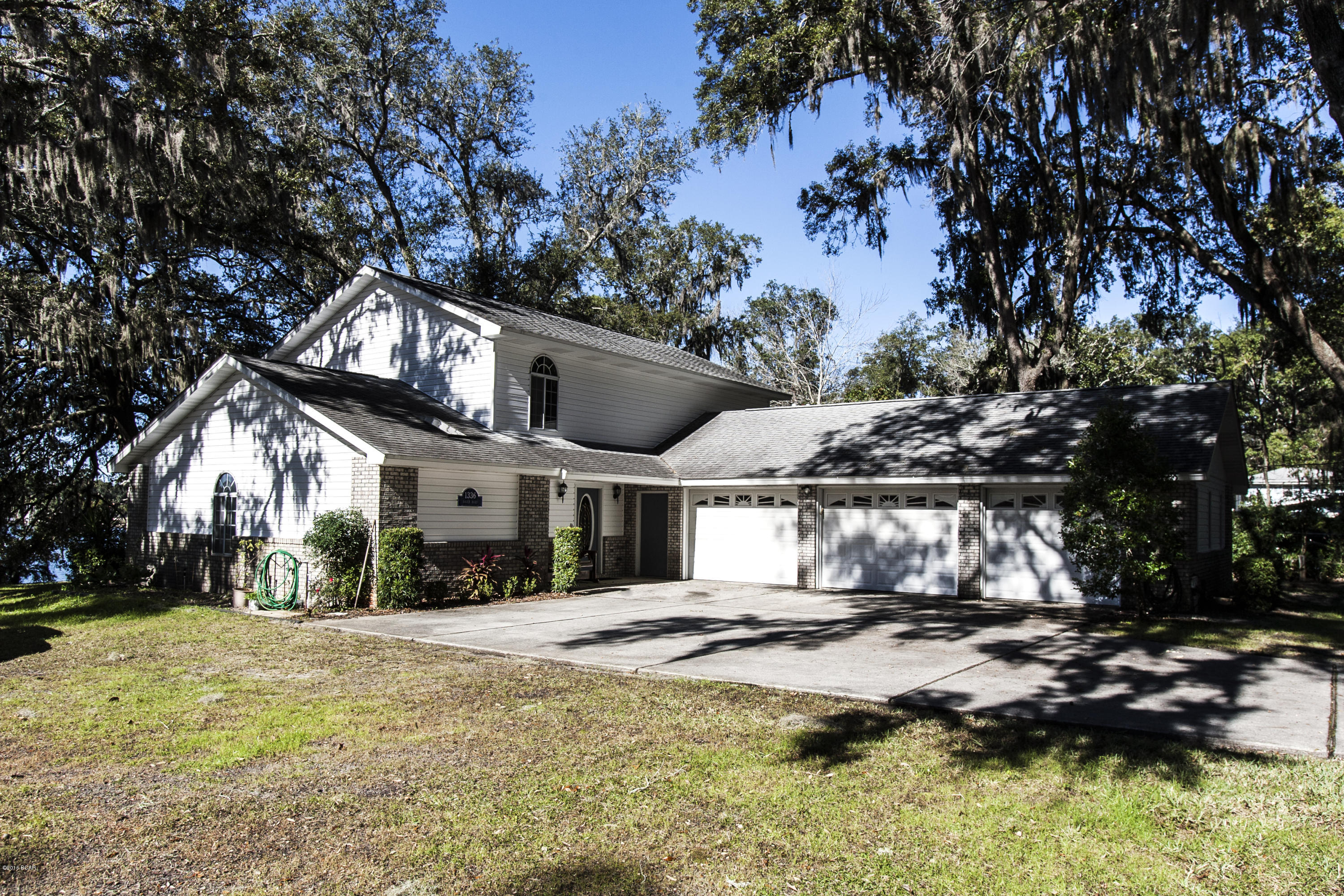 Looking for a waterfront 2 story with the master on the main level? Here it is! This spacious 3 bedroom 2.5 bath home sits on an oversized lot with beautiful shade trees. It features an open floor plan, island kitchen, plenty of cabinet and counter space and breakfast bar. The living areas overlook the gorgeous bay. Plenty of parking in the 3 car garage! Sprinkler system on private well. Very close to Tyndall AFB, schools and shopping.