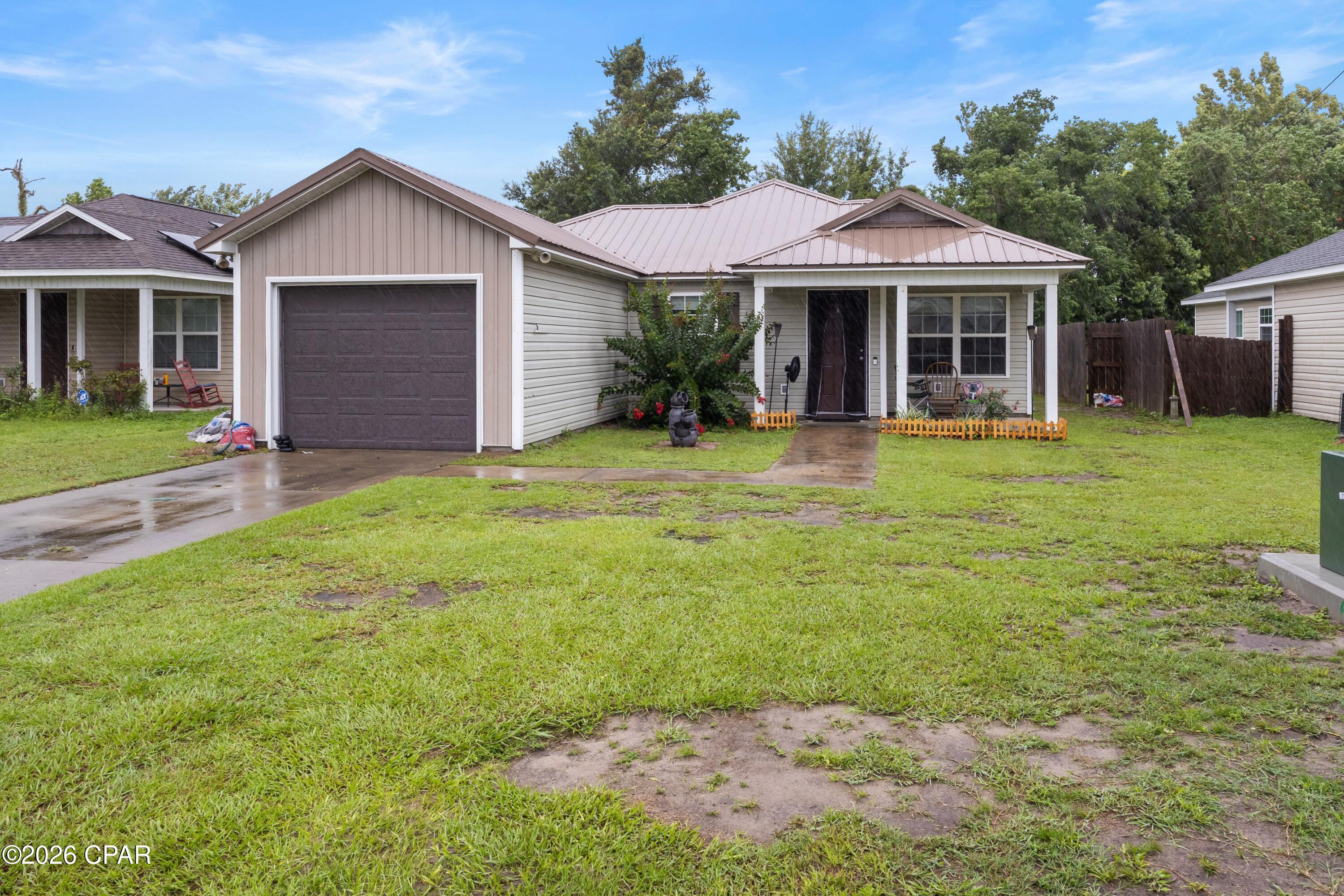 Centrally located and less than 10 miles to Tyndall Air Force Base and just 1.5 miles to Panama City Mall. This home has a great floor plan giving it a very spacious feel inside. The primary bedroom features an ensuite bathroom and ample closet space. The other bedrooms are of good size with plenty of closet space as well. The kitchen, dining, and living area are all open to each other, which is perfect if you enjoy entertaining friends and family. The garage can accommodate one car with plenty of additional room for storage. In the fully fenced backyard you will find a covered patio with plenty of green grass to enjoy!