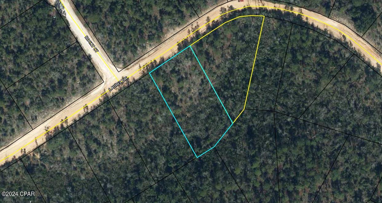 Two large adjoining lots at 169 x 332 (02-2N-11-0095-2060-0020 at 1.28 acres) and  292 x 302 at 2.02 acres, These lots are ready to be cleared for your summer or permanent home. Enjoy the water skiing, fishing in the pristine Compass Lake.  Great location off Highway 231 going South to Panama City or North to Mariana for shopping and restaurants.  Get away from the city life and enjoy the beautiful wildlife and nature.  Access to 2 lakes and for a fee of $135 (not mandatory), you can enjoy the amenities which include the Clubhouse, golf driving range, tennis courts, campgrounds, swimming pool access and much more. Please check out the Compass Lake in the Hills website for some additional information. This lot is ready to become your dream home. Buyer needs to verify all measurements for accuracy.