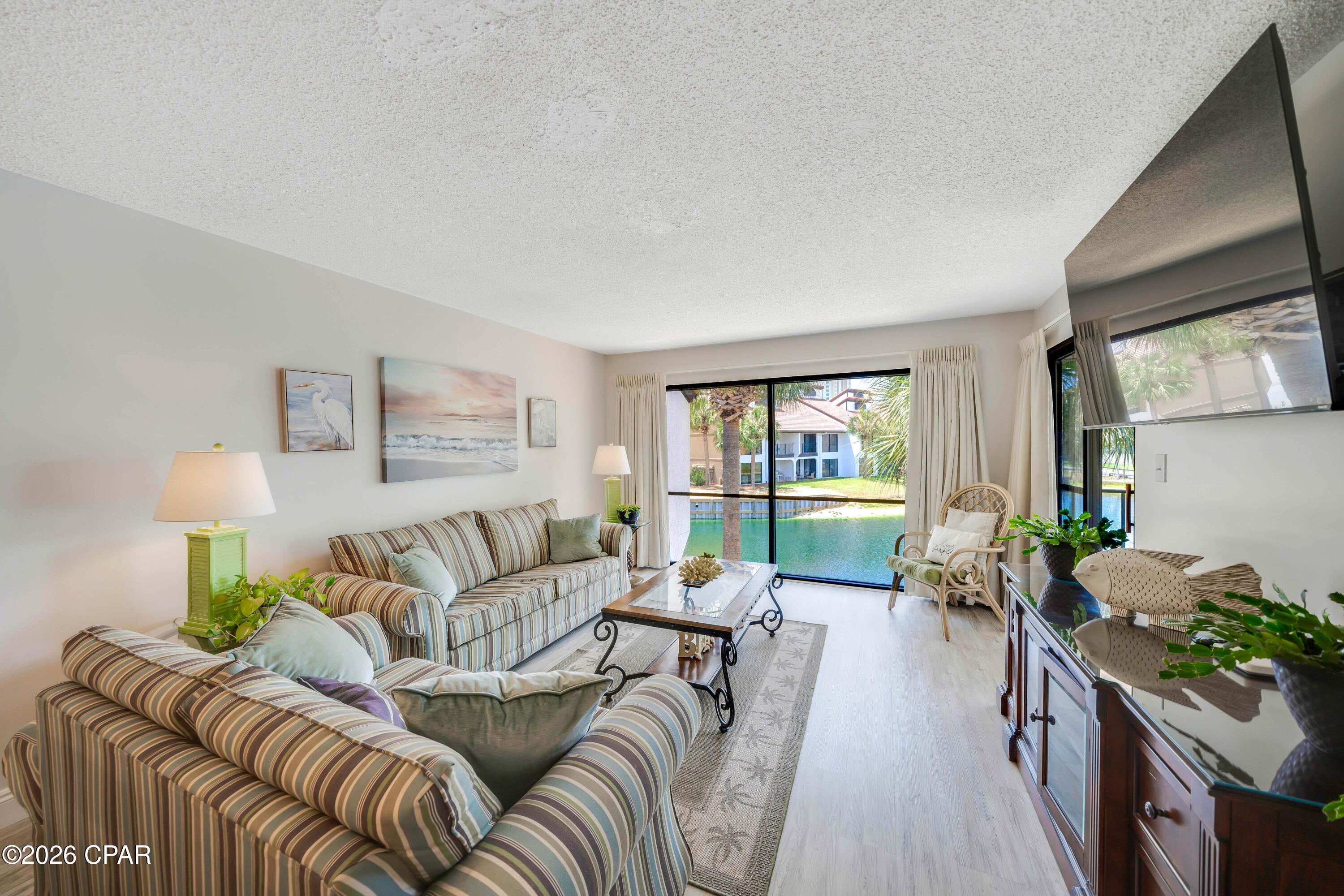 Welcome to this beautifully positioned 2-bedroom, 2-bathroom Golf Villa in the highly sought-after Villa Village at the iconic Edgewater Beach Resort. Unit 2111 offers peaceful second-floor living with expansive views overlooking a scenic pond featuring a captivating water feature and the lush fairways of the on-site executive golf course.
Step inside this inviting condo and enjoy an open, light-filled layout perfect for relaxing or entertaining. The spacious bedrooms and well-appointed bathrooms provide comfort for family and guests, while the thoughtfully designed interiors make everyday living effortless. A private balcony is the ideal spot to begin your day with your morning coffee, and watch the fountain dance.
Resort-Style Living at Its Finest
Edgewater Beach Resort is Panama City Beach's premier full-service destination. Residents and guests enjoy:

Easy access to the white-sand beaches via free tram service (just across the street).
Multiple pools and hot tubs, including dedicated options in the Villa Village.
A 9-hole executive Par-3 golf course right outside your door.
Tennis and pickleball courts, fitness center, and more.
On-site dining, shopping, and 24-hour gated security.

Whether you're seeking a primary residence, vacation home, or strong rental investment, this Golf Villa delivers tranquility with world-class amenities. The Villa Village setting provides a quieter, residential feel while keeping you connected to everything the resort has to offer.
Don't miss this opportunity to own a piece of paradise at Edgewater! Schedule your private showing today for Unit 2111.
