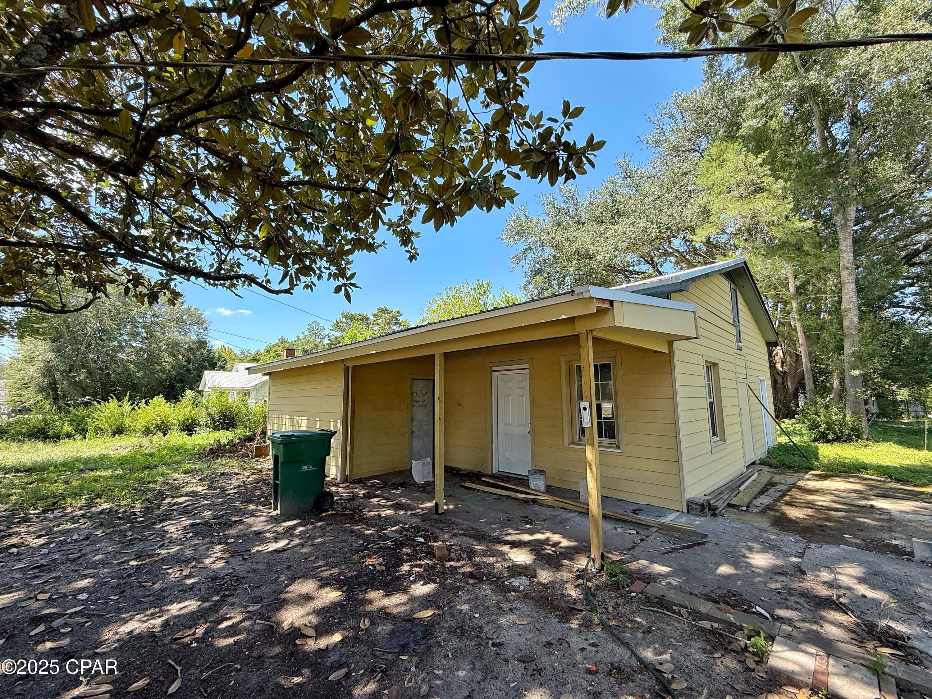Opportunity knocks in the heart of Graceville! This property is primed for investors or savvy buyers looking to build income-producing rentals. The existing structure has a strong head start with new Hardie board siding and a new roof already completed--the big-ticket exterior work is done for you. With interior renovations, you can quickly transform it into a 2-bedroom, 2-bathroom rental unit as the anchor for your project.

But the real value lies in the expansion potential: this site is set up to add up to 6 additional units, with city water, sewer, and some power poles already in place. That's the infrastructure you need to scale and create an excellent multi-unit investment property, all within Graceville's convenient downtown setting.

Whether you finish the remodel for a single rental or develop the entire property for maximum returns, this is a rare chance to step into a project with both momentum and huge upside.