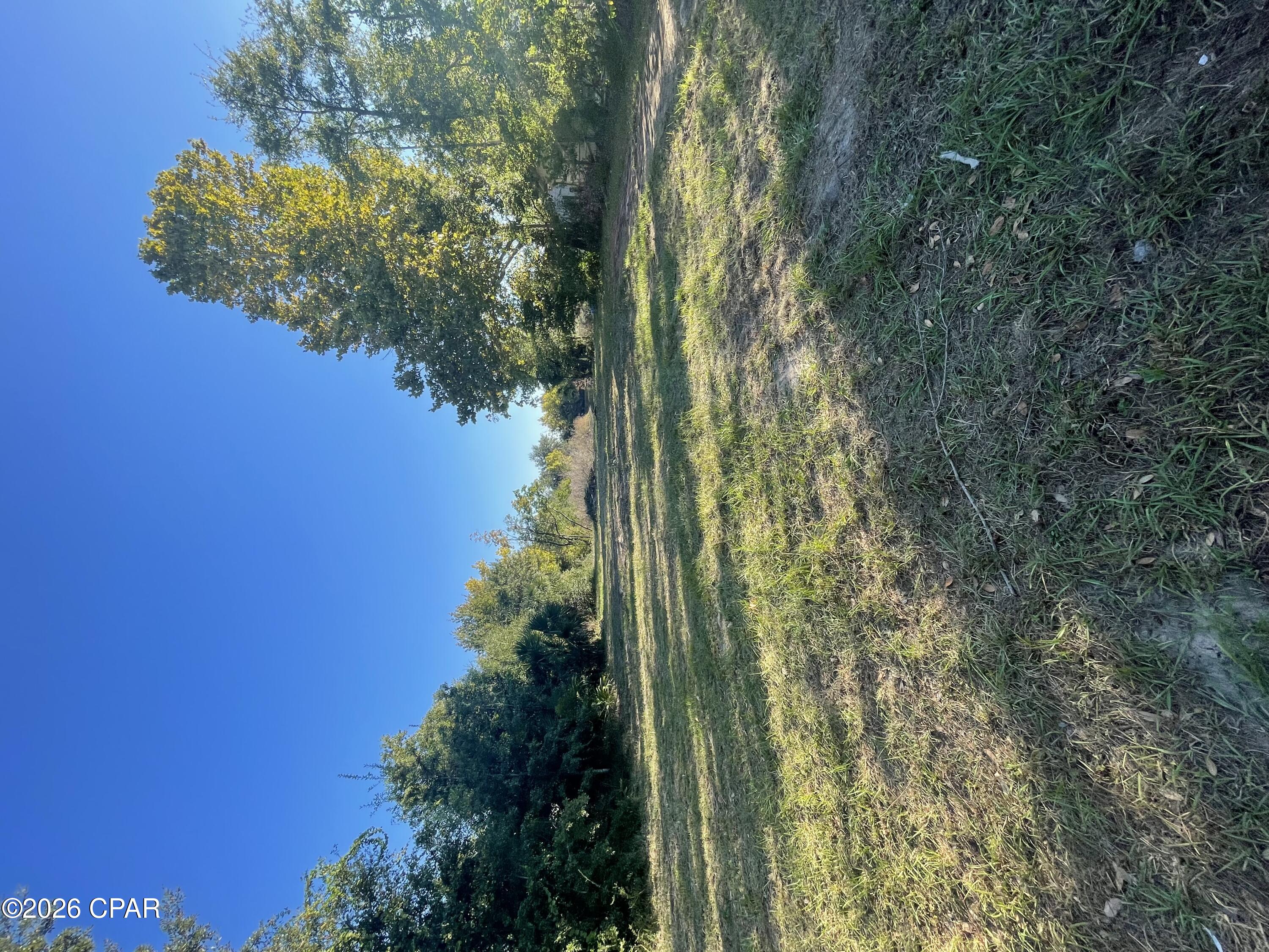 Beautiful Pondside Lot is ready to build your new home. Located in a well-established peaceful neighborhood with NO HOA. All utilities are in place, thanks to a prior structure cleared in 2020. Seller has cleared site of underbrush making it truly ready to build. Excellent location centrally located to the Beaches, Tyndall AFB, shopping and restaurants. Don't miss this rare build-ready opportunity. Call today! Buyer to verify all information deemed important.