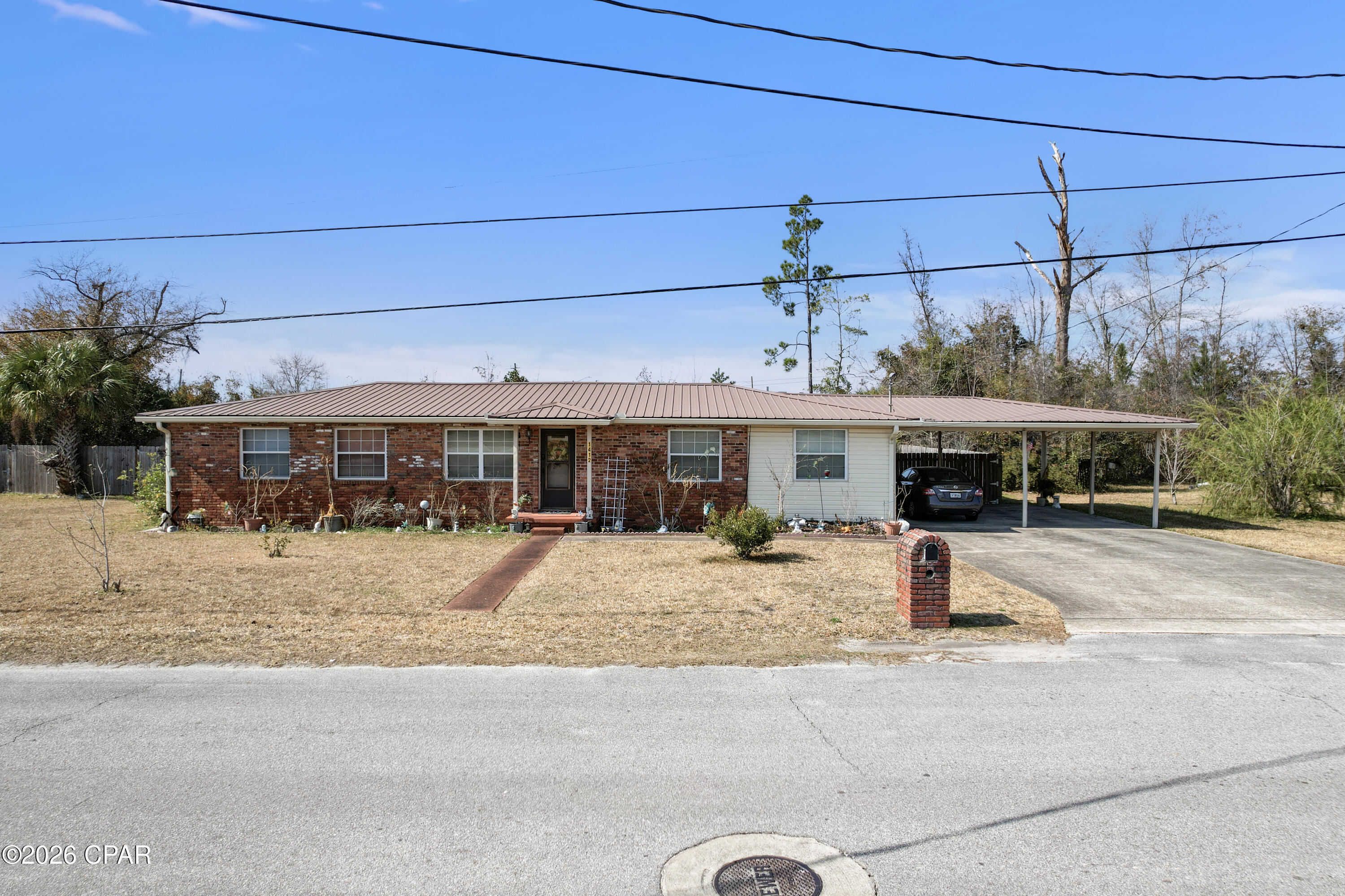 1412 Alabama Ave | Lynn Haven, Florida

Right in the heart of Lynn Haven sits a piece of old Florida charm you just don't find anymore. Welcome to 1412 Alabama Avenue — a home that carries that sweet Southern character and small-town warmth we all grew up loving.

From the moment you pull up, you'll feel it — mature trees, a welcoming presence, and the kind of setting where neighbors still wave as they drive by. This home has that timeless, ''they don't build them like this anymore'' feel, full of personality and ready for its next chapter.

Out back, you'll find a garage that could use a little TLC, but the potential is undeniable. Whether you're dreaming of a workshop, extra storage, or restoring it to its full glory, the opportunity is there.

And here's the part that truly makes this property special — an unheard-of triple lot right in the middle of town. Space like this in Lynn Haven is incredibly rare. Room to expand, garden, build, or simply enjoy the elbow room that's nearly impossible to find this close to everything.

Want even more possibilities? This property could also be sold together with 1408 Alabama Ave, creating a full acre in the heart of town. A whole acre. In Lynn Haven. That's the kind of opportunity investors and visionaries wait for.

Close to parks, schools, local shops, and all the hometown favorites that make Lynn Haven so special — this is more than just a property. It's a chance to own a slice of classic Florida living with room to grow.

If you've been waiting for character, land, and location all in one... this might just be it. 🌿✨