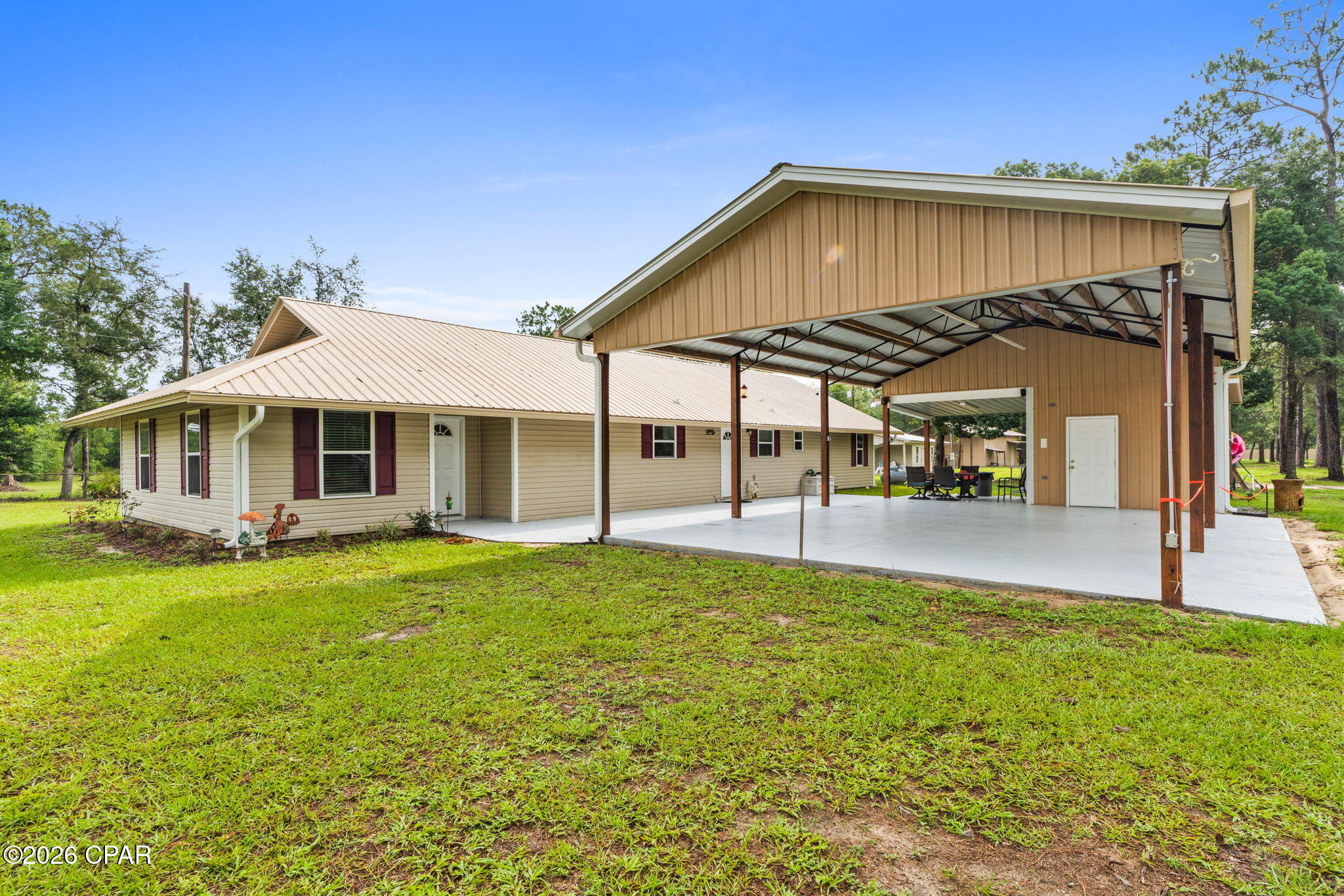 Welcome to your private slice of country living at 13816 Fiddlers Green Rd--an exceptional multi-use property set on over 2 acres, featuring a spacious main home, a fully equipped apartment, and an incredible workshop setup you won't find anywhere else.

The main residence offers warm, comfortable living with an inviting layout, large living room with tray ceilings, and a charming galley-style kitchen with abundant cabinetry, solid surface countertops, and a walk-in pantry. Multiple living and dining spaces make this home ideal for entertaining or spreading out. The main house is 3 bedrooms, 2.5 baths 2044 sqft. The second bath has a jet tub.

Tucked just steps away is a separate apartment--perfect for multigenerational living, guests, rental income, or a private home office. With its own full kitchen, living area, bathroom, and laundry space, it's truly move-in ready. Apartment is 2-bedroom and 1204 sqft.

Outside is where this property becomes something truly special. A massive pole barn with loft provides outstanding workspace, storage, and hobby potential. Whether you're a craftsman, mechanic, boater, or outdoor enthusiast, this setup checks every box. The barn includes enclosed workshop space, overhead storage, and multiple covered bays. An additional open-air storage garage offers even more room for equipment, trailers, RVs, or outdoor toys.

With plenty of cleared yard space, mature trees, and a peaceful rural setting, this homesite offers the perfect blend of privacy and functionality--all while still being within a short drive to town, schools, and amenities. The proposed paving of Fiddlers green is in the planning stages.

If you've been searching for land, flexibility, and endless possibilities, this property delivers it all. Schedule your private tour today.
