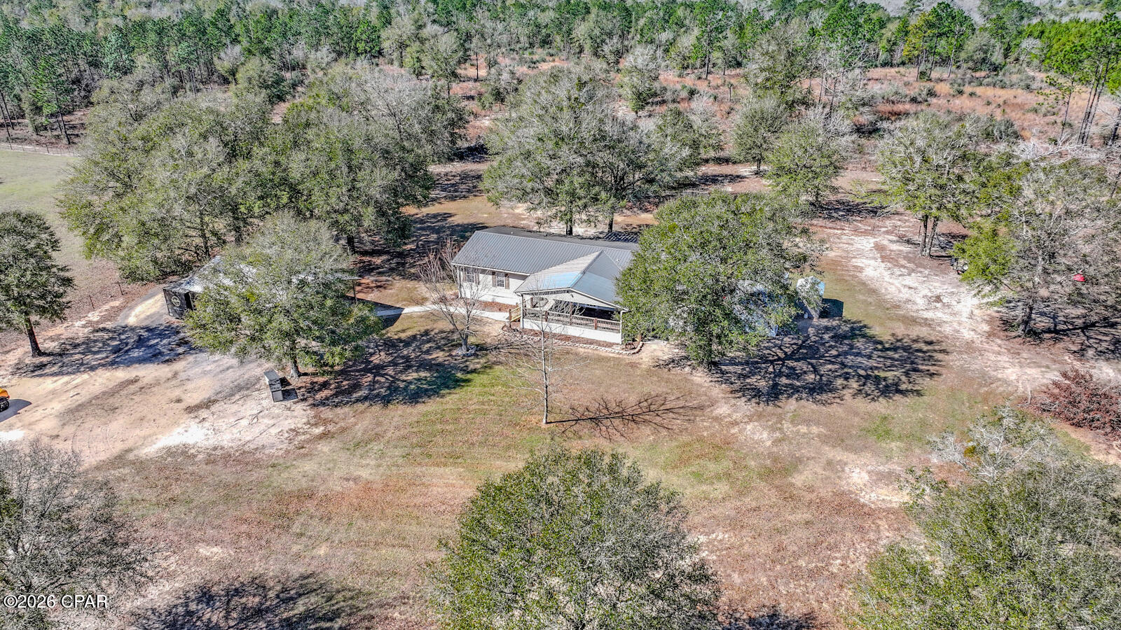 Situated on two peaceful acres, this property offers the comfort and freedom of country living with room to truly make it your own. The peaceful setting allows you to enjoy a slower pace while still having the space and functionality needed for everyday life.

The interior features a split floor plan designed for privacy and easy living. The spacious kitchen provides abundant counter space and a natural gathering area, making it ideal for both daily routines and entertaining.

A covered front porch adds to the home's charm, offering a welcoming place to enjoy morning coffee or relax in the evenings while overlooking the property.

The pole barn enhances the property's versatility, providing excellent space for storage, a workshop, hobbies, or equipment. With two acres to work with, there is ample opportunity to create the outdoor setup that fits your lifestyle.

For those seeking space, flexibility, and a peaceful setting, this property presents a wonderful place to call home.