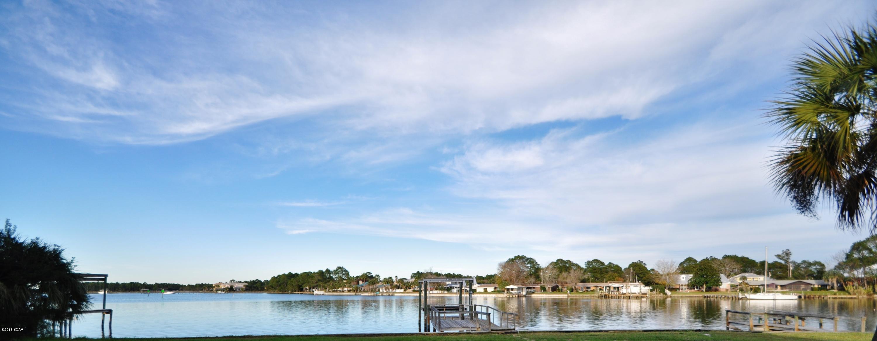 Minutes to the Gulf by boat!! Dock 12,500 lb boat lift..waterfront 4 bedroom 2900 sq ft in Northshore.. This home has brand new septic.. New roof, New wood floors..and READY to move into.It is so big that even the laundry room has a full bath in it.. Large 1/2 ac lot..and has DEEP water access. You have a sunroom with amazing views of the bay. Just think come back in from catching your own fresh snapper.. pull up to the house Clean and cook yourself a marvelous dinner.. then relax in your own hot tub on the deck... That's Right The HOT TUB is included!! This is a must see home 2 huge living rooms 2 dinning room a den a fireplace.. so so much Call now for your private showing.. Size are approximate please verify if Important to you.