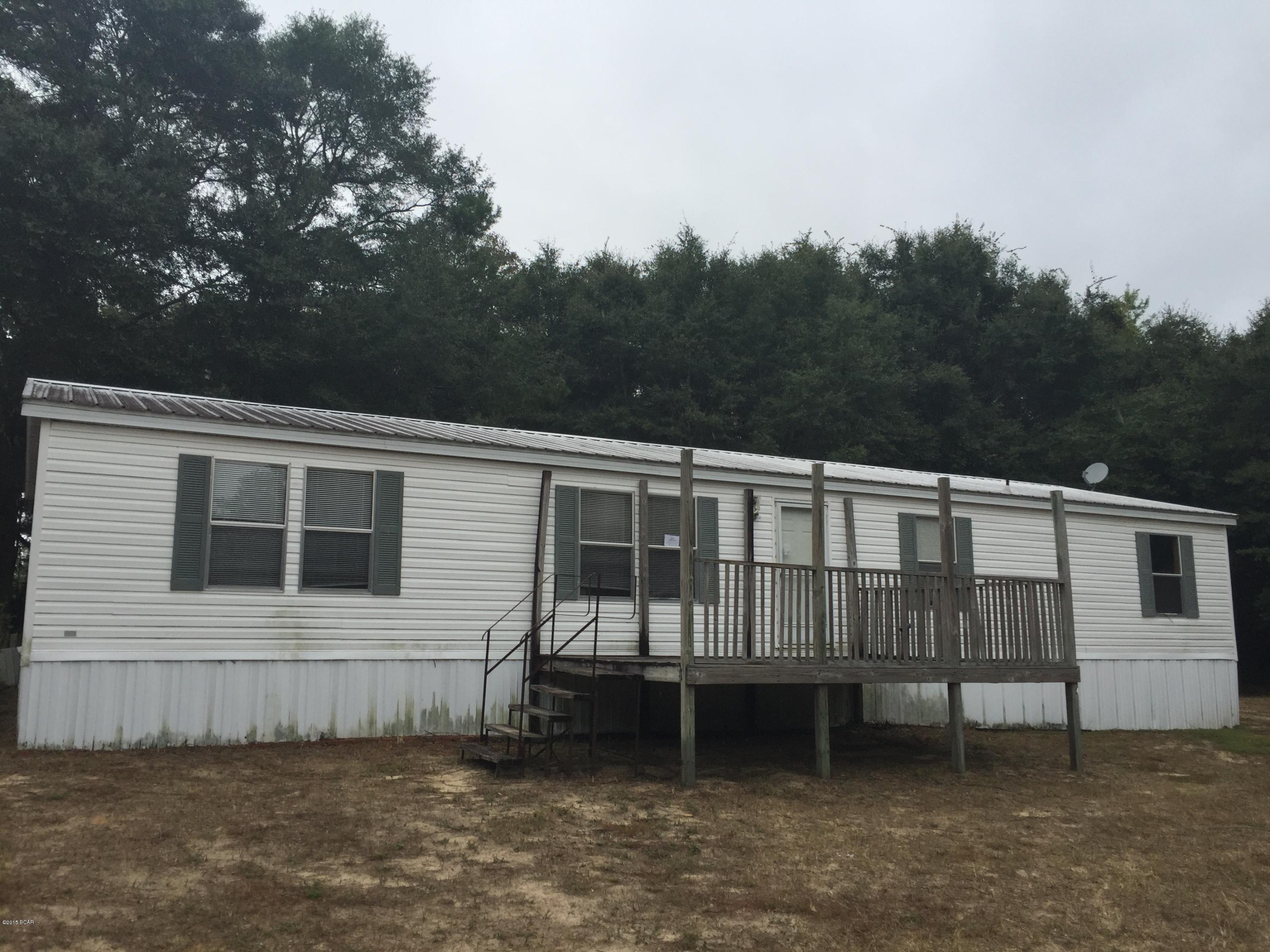 Although Florida is not known for being hilly this home is nicely situated on a high point in the foothills of the central Panhandle. If you want to be  surrounded by good fishing and hunting and still be within 25 minutes of the beach,  this may be your opportunity. This two acre opportunity gives you all the solitude of country living and none of the congestion of the busy beach areas while still being close enough to enjoy the best shopping and restaurants. This home is spacious with 4 bedrooms, 2 bathrooms and a bonus room.