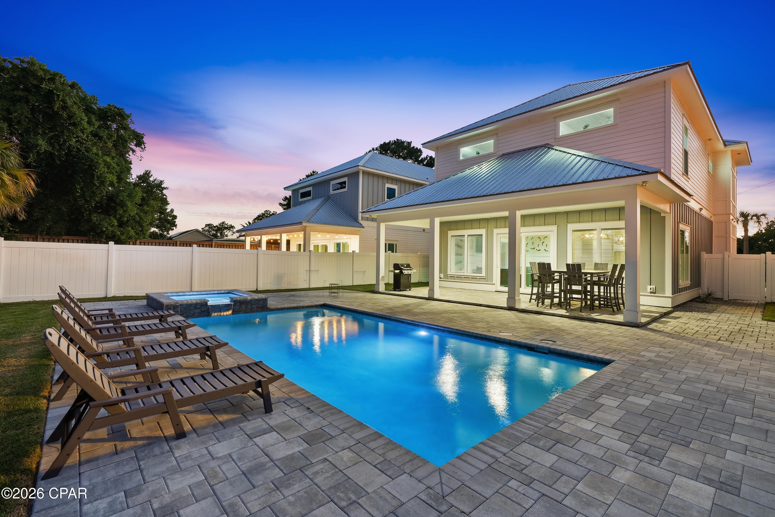 Welcome to 322 E. Lakeshore Drive, a stunning coastal retreat built in 2023 in the highly sought after Laguna Beach community on the desirable west end of Panama City Beach. Just a short walk to the sugar-white sand beaches and emerald waters of the Gulf, this beautifully designed 5 bedroom, 4 bathroom home sleep 18 and offers the perfect combination of luxury, location, and investment potential with no HOA fees! 

Whether you're searching for a high performing vacation rental, second home, or full time beach residence, this property checks every box. Designed to comfortably accommodate large families and groups, the spacious open concept floor plan features a beautifully appointed living area, a chef-inspired kitchen with an oversized island and breakfast bar, and generous dining space ideal for gathering after a day at the beach.

Step outside to your own private backyard oasis featuring a sparkling heated pool and spa, creating the ultimate space to relax, entertain, and enjoy the Florida sunshine year round. From morning coffee by the pool to evenings under the stars, this outdoor retreat is what beach living is all about.

Each bedroom has been thoughtfully designed to provide comfort and privacy, while additional bunk accommodations allow the home to sleep multiple guests with ease, making it an exceptional short-term rental opportunity.

Location is everything, and 322 E. Lakeshore Drive delivers. Nestled in the charming, golf-cart-friendly community of Laguna Beach, you'll enjoy easy access to the beach while remaining just minutes from local favorites like Thomas Donut & Snack Shop, Carousel Supermarket, and the shopping, dining, and entertainment of Pier Park. The scenic communities of 30A are also just a short drive away, offering even more opportunities to explore the Emerald Coast.

With modern construction, luxury finishes, a private pool and spa, and an unbeatable location on the west end of Panama City Beach, 322 E. Lakeshore Drive is an outstanding opportunity to own a piece of paradise while generating impressive rental income. Schedule your private showing today and experience everything this exceptional beach home has to offer.