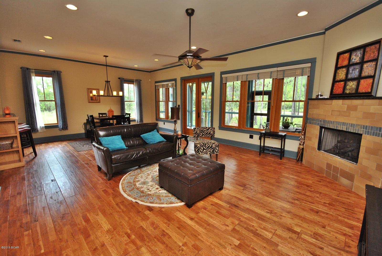 Picturesque views abound from this Coastal Craftsman inspired masterpiece featuring unparalleled panoramic views overlooking Wild Heron's nature preserve.  Homes of this magnitude are rarely exposed to the market & artfully combines contemporary design with classic naturalist architecture indicative of Wild Heron & its beautiful surroundings. Positioned in the most desirable area of the Wild Heron community, this home is perched at one of the highest elevations in Wild Heron and overlooks the serene nature preserve. The individualized architectural detailing of this home is evident as soon as you walk in the door as you are greeted with 10.5 foot ceilings on the first floor, custom gas fireplace nestled among warm ambiance that the most discerning buyer will appreciate.  Coupled with the arts and crafts design of the most prominent Wild Heron estates, many of the features of this home such as oak hand railing, spacious and open space in the dining and living area, granite breakfast bar with stainless steel appliances, and under-cabinet lighting, make this home a must-see the sophisticated buyer.
The downstairs master bedroom has a his and hers closet.  The master bathroom has a granite double vanity, Eago pedestal tub, decorative tile, and oversized mirrors.  The upstairs provides privacy as you are greeted with a large loft landing, and office nook with computer tables and ample shelves and storage space.  The garage has separate door for golf cart and storage.  Unique and rich Coastal Craftsman detail abounds with every window and finish in this premier home.  In addition, a private back porch is screened with unparalled golf course views.  Wild Heron homeowner amenities include pool, hot tub, fitness center, boathouse with canoes and kayaks for your use, boardwalks and fire pit by Lake Powell, picnic areas, playground, lots of space for bike riding and walking and places to view spectacular sunsets. Wild Heron is a truly unique community that coincides with nature.