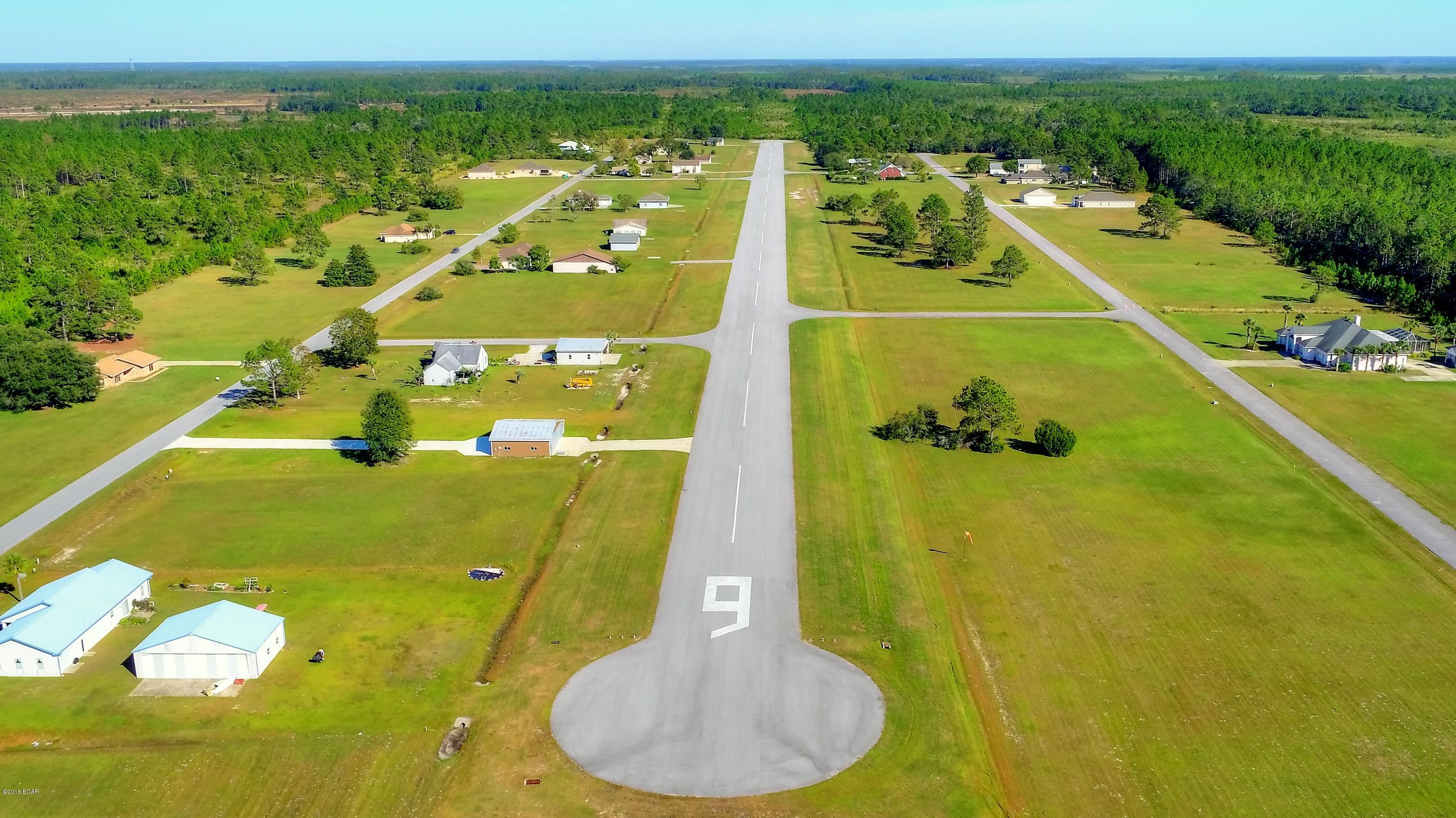 RUN WAY LOT..Welcome to Sandy Creek Air Park, a gated pilots paradise. Experience the freedom of flying far from the restrictive airspace of the big city. We offer underground utilities, a community center, we are permitted for 5 Hangers. The paved runway is 3200 feet with lights and beacon for night time flying. The FAA airport designator is 75FL located on the New Orleans sectional chart. Subdivision has a total of 100 residential lots, several commercial lots. We have Run way lots starting at 45,000. and Run way access lots starting at 35,000.  Come build your dream home on a residential airpark home site while enjoying the Florida climate with VFR conditions 300 days a year. No more fighting traffic, no more hanger fee's, and no more snow.