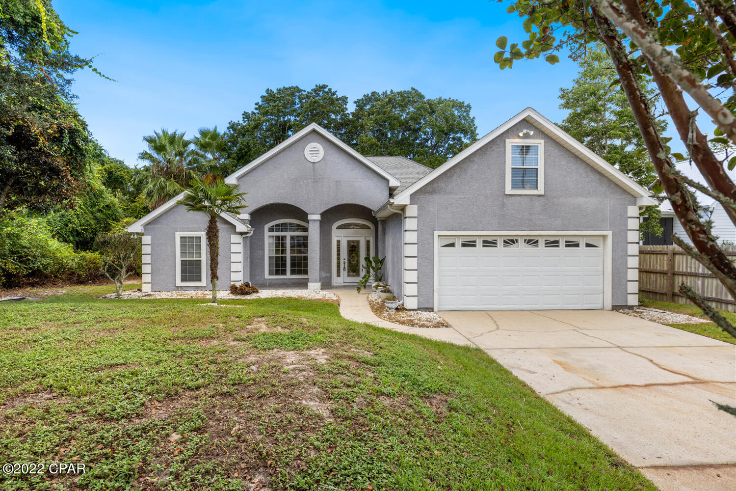 CURRENTLY UNDER CONTRACT, SELLER WILL CONSIDER BACKUP OFFERS Just Reduced $30,000! 4-Bedroom home within walking distance to the beautiful Gulf-Of-Mexico.  This home has so much to offer and is move-in ready.  As you enter through the beautiful leaded glass door you can feel the amount of space this home has.  The living room features 10' ceilings, crown molding, a gas fireplace with a custom mantel, and French doors leading to the 26.6x9.7 screen enclosed porch.  The open living areas include 10' ceilings, a lot of natural light through their arched windows and doorways, surround sound in the living room/enclosed porch, and the home has porcelain tiled floors throughout, including the front porch and screen enclosed porch.  No Carpet!  The kitchen is open to the breakfast and living room and features granite countertops, custom wood cabinets, decorative recessed lighting, under cabinet lighting, an extra deep sink, and all appliances remain with the home.  This split bedroom floor plan has a wonderful layout. The master bedroom is to the right of the home and has a tray ceiling, large walk-in closet, and has a master bath with double vanity sinks and a large tiled, glass enclosed walk-in shower.  There are two other bedrooms and a full bathroom, with a bathtub, to the left of the home, and the fourth room, or bonus room is on the 2nd floor. The air conditioning system was replaced in 2013 and the water heater in 2018. The home was recently pressure washed, and some minor repairs/painting done to get it ready to list. If you have ever dreamed of living within a reasonable walking distance to the Gulf-of-Mexico, in a golf cart friendly community, this home is for you.  Schedule an appointment to view before your dream of owning a piece of paradise becomes someone else's reality.  Age, Sq.Ft., Rooms sizes, schools, taxes, or any important information is an estimate only and must  be verified by the buyer via personal or professional inspection if important.