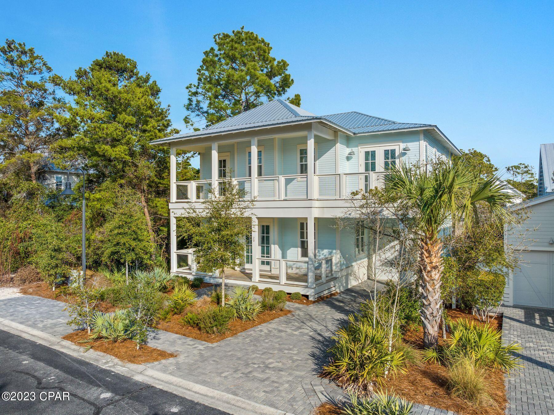 Beautifully appointed and perfectly located in the sought-after community of Lakeside at Blue Mountain Beach, this two-story beach cottage exudes comfortable, coastal luxury. It sells fully furnished and turn-key ready, ideal as a rental investment or second home. Situated a short walk to the community pool and less than a half mile from easy beach access with parking, this 4 bedroom, 3.5 bath home is the ultimate vacation escape featuring over 1,200SF of covered porches and balconies, an attached garage, and an inviting open floor plan. Interior features include LVP flooring, quartz countertops, and more. Enjoy the afternoon shopping and dining in Blue Mountain Beach, paddleboarding on Big Redfish Lake, or exploring neighboring communities along Scenic 30A via the bike trail.
