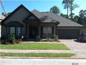 Beautiful home less than 3 years old with numerous upgrades. State of the art in-ground gunite pool with hot tub built by Cox Pools. Great outdoor space with large covered patio and outdoor TV. McKenzie floor plan with spacious kitchen/breakfast area/living combined in addition to formal dining & living spaces. Hardwood floors throughout except in baths & bedrooms. Security system with remote accessing/enabling feature with smart phone. Tankless gas hot water heater & 5 burner gas stove w/interchangeable grill/griddle grate. Upgraded stainless steel appliances & granite countertops. Mussett Bayou is a 24 lot gated community close to shops, restaurants, and short drive to the beach. This is a MUST SEE! Seller is a licensed Florida real estate associate.
