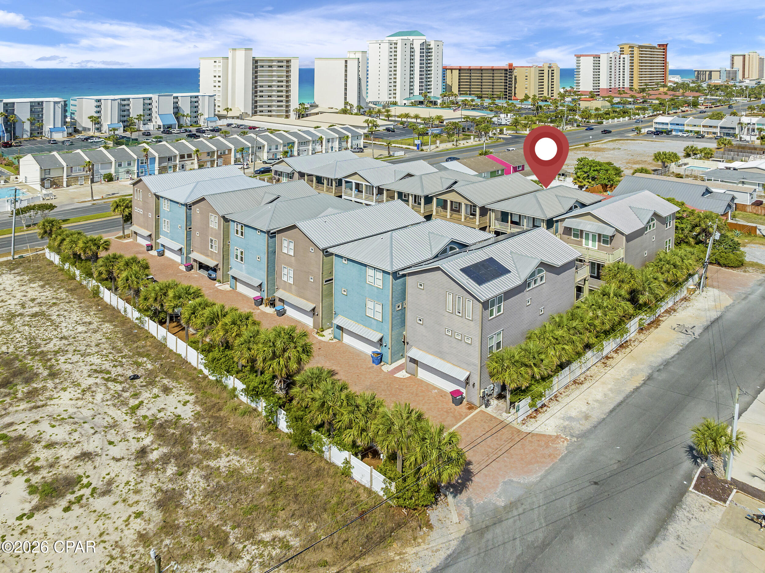 Three-Story Beach Home on Iconic South Thomas Drive - Walk to the Beach!

This spacious 4-bedroom, 4-bathroom home (2,367 sq ft) in the desirable Panama Dunes community offers the perfect blend of location, layout, and lifestyle potential. Just 0.2 miles (a 5-minute walk) to Bay County Public Beach Access #12 -- easy access to put your toes in the sand.

Boater's Dream Location
Four public boat ramps are conveniently nearby along South Lagoon Drive, with the closest just 0.5 miles away (near Quail Street and Raven Street). For larger vessels, dry storage and wet slips are available less than 2 miles away at Pirate's Cove Marina (up to 37' dry / 70' wet) and Treasure Island Marina (up to 46' dry / 60' wet).

Community & Convenience
Panama Dunes is nestled between Holiday Beach and Biltmore Beach in the charming Lower Grand Lagoon area. Enjoy nearby dining, and entertainment. Grocery shopping at Magnolia Plaza is just 2.8 miles away, home to Publix, Aldi, and more.

Thoughtful Floor Plan  
* Ground Level: 444 sq ft 2-car garage, guest bedroom suite with kitchenette, full bathroom, and covered patio.  
* Second Level: Open-concept kitchen, dining, and living area with balcony, additional bedroom, full bathroom, and laundry room.  
* Third Level: Fourth bedroom with en-suite bathroom, primary suite with luxurious spa bathroom, and a balcony offering partial Gulf of Mexico views.
All patios and balconies face southeast, overlooking the community greenspace and pool area -- perfect for relaxing or entertaining.

Priced to reflect the opportunity for exterior and interior updates, this as-is home is ideal for a primary residence, second home, or short-term rental investment in a prime beach-adjacent location.

Schedule your private tour today and imagine the possibilities!

Disclaimer: Interior photos are archival, furniture and decor pictured is not representative of what is currently present in the home.
