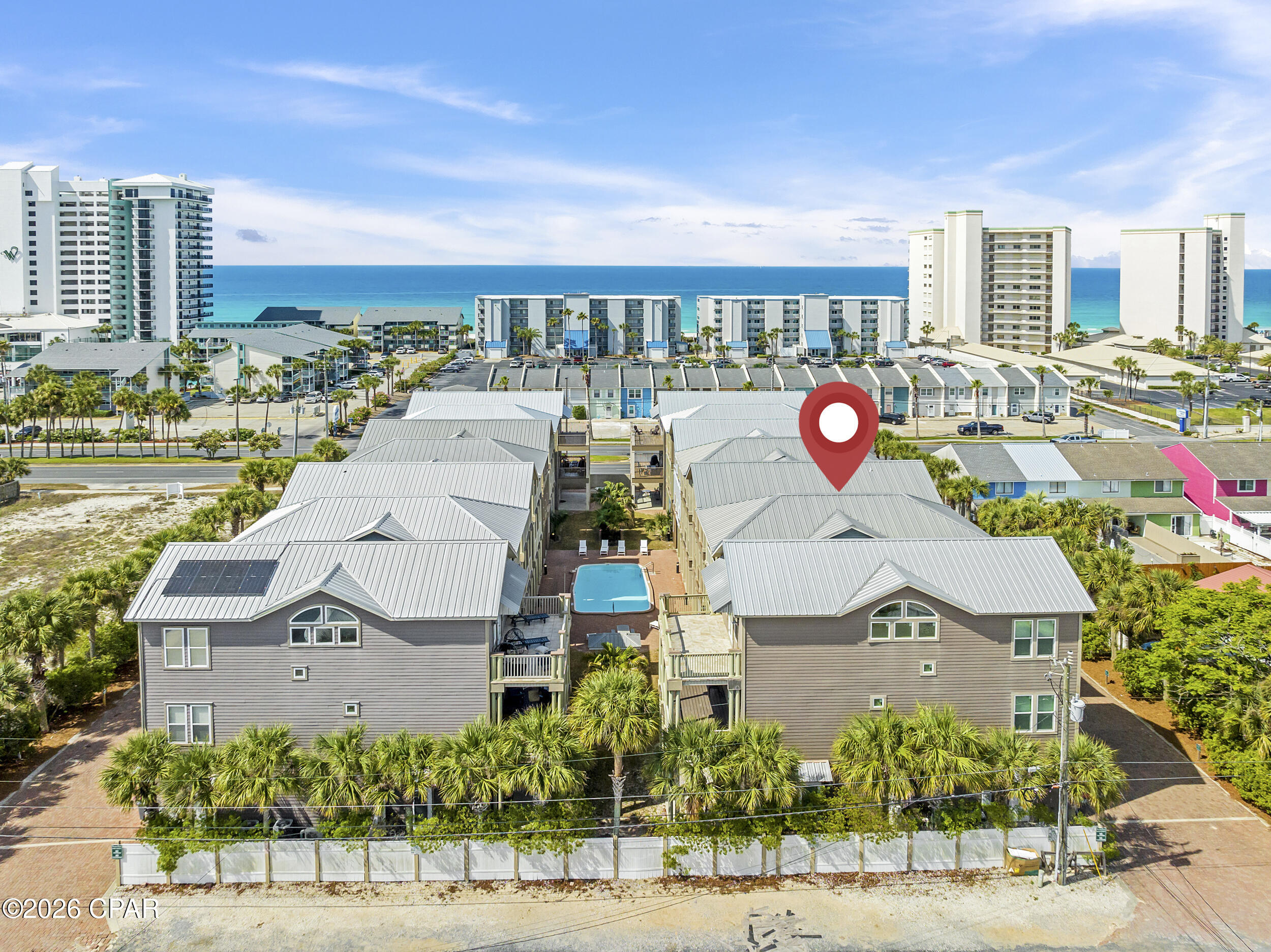Three-Story Beach Home on Iconic South Thomas Drive - Walk to the Beach!

This spacious 4-bedroom, 4-bathroom home (2,367 sq ft) in the desirable Panama Dunes community offers the perfect blend of location, layout, and lifestyle potential. Just 0.2 miles (a 5-minute walk) to Bay County Public Beach Access #12 -- easy access to put your toes in the sand.

Boater's Dream Location
Four public boat ramps are conveniently nearby along South Lagoon Drive, with the closest just 0.5 miles away (near Quail Street and Raven Street). For larger vessels, dry storage and wet slips are available less than 2 miles away at Pirate's Cove Marina (up to 37' dry / 70' wet) and Treasure Island Marina (up to 46' dry / 60' wet).

Community & Convenience
Panama Dunes is nestled between Holiday Beach and Biltmore Beach in the charming Lower Grand Lagoon area. Enjoy nearby dining, and entertainment. Grocery shopping at Magnolia Plaza is just 2.8 miles away, home to Publix, Aldi, and more.

Thoughtful Floor Plan  
* Ground Level: 444 sq ft 2-car garage, guest bedroom suite with kitchenette, full bathroom, and covered patio.  
* Second Level: Open-concept kitchen, dining, and living area with balcony, additional bedroom, full bathroom, and laundry room.  
* Third Level: Fourth bedroom with en-suite bathroom, primary suite with luxurious spa bathroom, and a balcony offering partial Gulf of Mexico views.
All patios and balconies face southeast, overlooking the community greenspace and pool area -- perfect for relaxing or entertaining.

Priced to reflect the opportunity for exterior and interior updates, this as-is home is ideal for a primary residence, second home, or short-term rental investment in a prime beach-adjacent location.

Schedule your private tour today and imagine the possibilities!

Disclaimer: Interior photos are archival, furniture and decor pictured is not representative of what is currently present in the home.