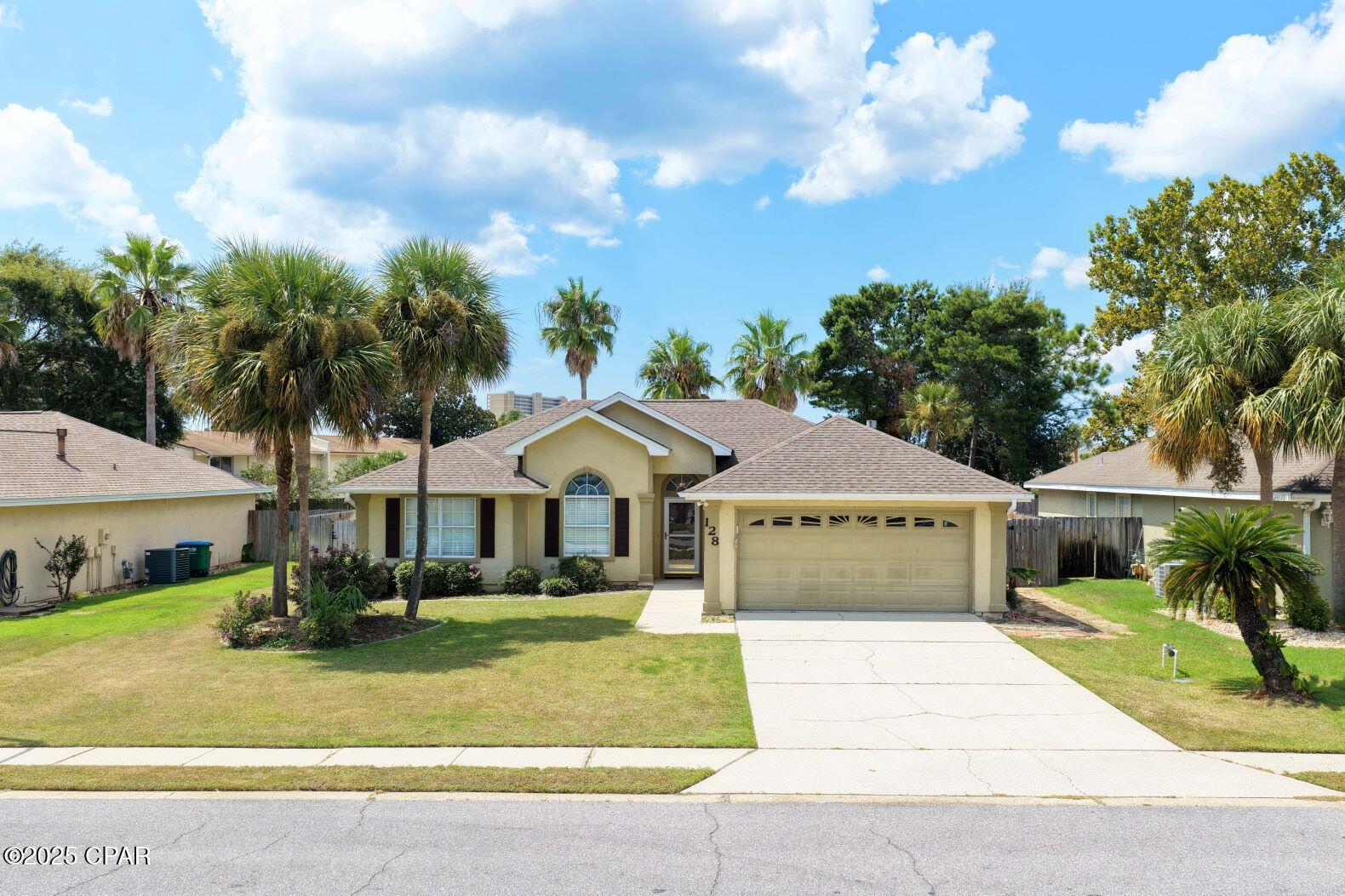 Welcome to 128 Bonaire Drive, the home at the beach that you have been wanting to see hit the market.   Located in the Summer Breeze neighborhood, less than a half mile from the beach, this home has  the LOCATION LOCATION LOCATION that is most important at the beach.   With 3 bedrooms, 2 baths and an open concept, this one is perfect for a primary residence, second home or a vacation home. All 3 bedrooms are spacious and fitted with luxury vinyl flooring for easy maintenance.  The living area opens into the dining room and kitchen nicely, making it feel much larger.  The kitchen has a generous appliance package, loads of cabinet space and features solid surface countertops.   Indoor living is extended outside to the screened in patio overlooking the inground, heated gunite pool. A two car garage takes care of parking.   This one checks all of the boxes for beach living. CALL TODAY