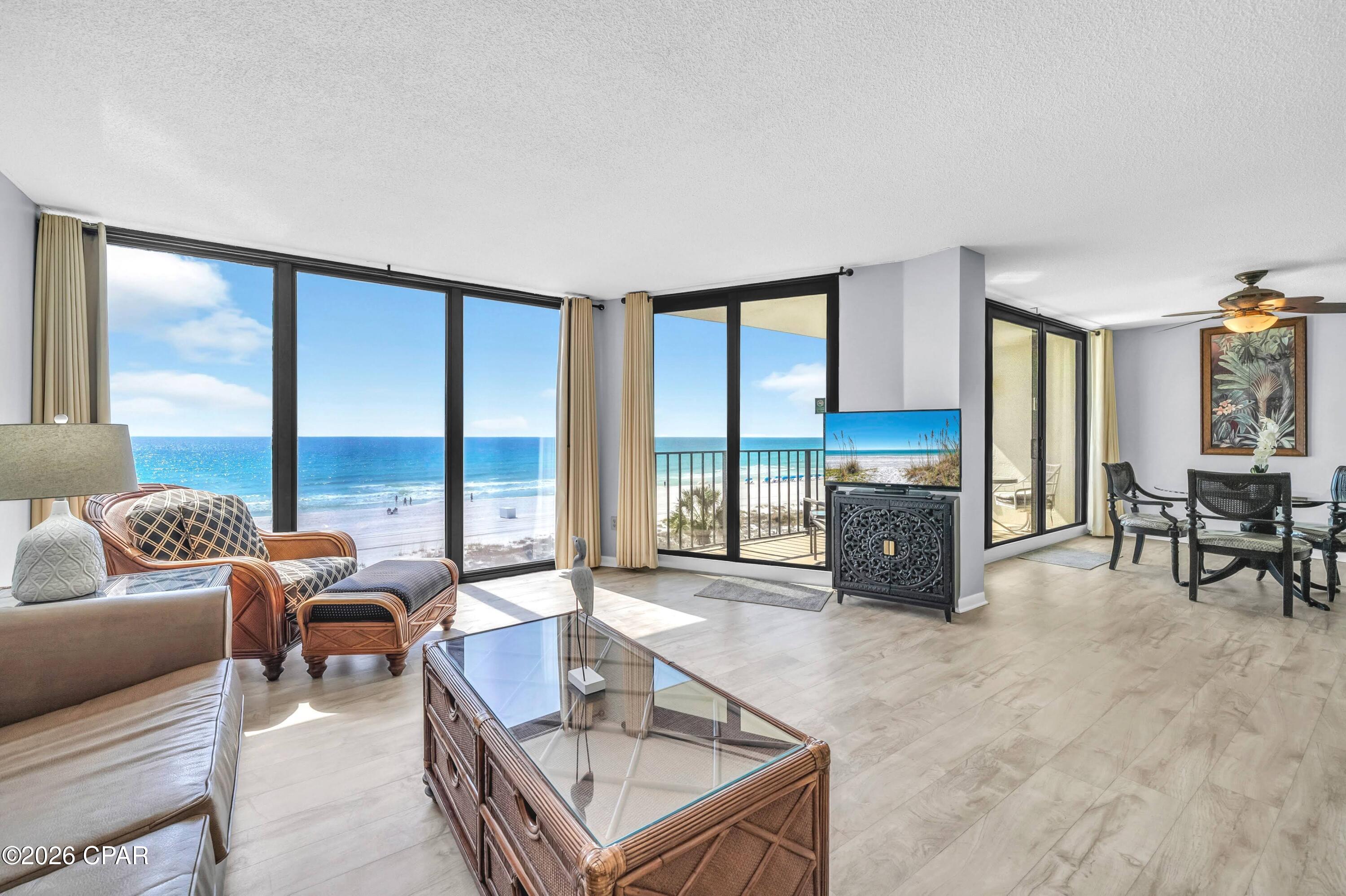 Welcome to Edgewater excellence in Tower II-307, featuring the coveted 'Deluxe' floor plan that delivers the resort's most spacious 2-bedroom design plus massive rental opportunity. This well-maintained third-floor retreat is sold fully-furnished and features several high-value updates, including a 2021 HVAC system and newer hurricane-rated floor-to-ceiling sliding glass doors for seamless balcony access. The kitchen is equipped with stainless steel appliances and painted white cabinets. Throughout the unit is upgraded wood-look flooring and tile (no carpet!). The dining room flows to the large balcony which provides spectacular, direct views of the emerald waters and white sands from a vantage point that feels remarkably connected to the beauty of the Gulf. 

Since it is already on a rental program, a new buyer has the opportunity to begin collecting rental income immediately. Comparable 2-bedroom units at Edgewater are generating $50,000-$60,000 annually! Now is the perfect time for a new buyer to add their own personal flair and coastal vision to capitalize on rental potential. Tower II is an ideal location, situated west of the grand lagoon pool and closer to the beach than Tower I for added privacy and easier shoreline access. 

Edgewater Beach and Golf Resort remains a landmark destination in Panama City Beach, offering an array of amenities that no other complex can match. The HOA is in a strong position with all required inspections completed and no special assessments pending. Edgewater offers direct beachfront access and a wealth of on-site conveniences including a beachfront restaurant, market, pizza, and ice cream shop. Stay active at the large fitness center, pickleball and tennis courts, or the golf course located right on the property. The guarded security gates and proximity to a plethora of local dining and attractions make this one of the most sought-after locations on the Emerald Coast. Whether you are looking for a beach home or a strategic investment, this unit offers a solid foundation at an incredible value. Schedule your showing today to experience the amazing Gulf views and the endless possibilities of this Tower II Deluxe oasis. A video tour is also available