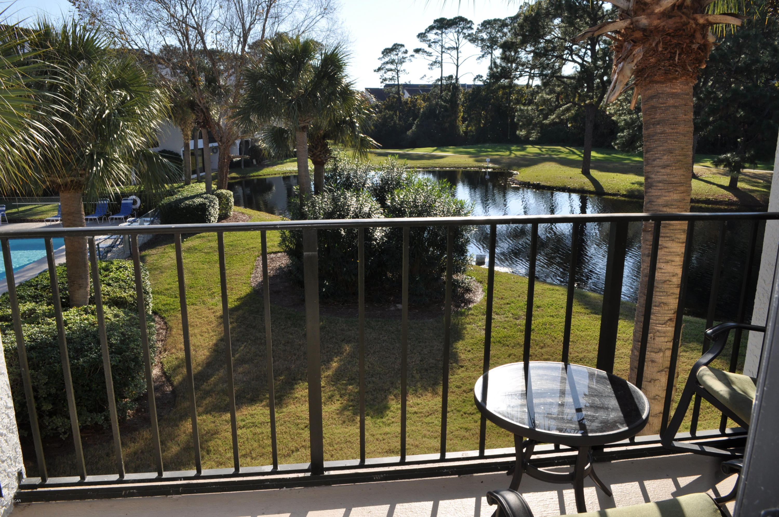 Practically brand new and finely appointed Edgewater Golf Villa overlooking a pool and a pond!  This 2BR/2BA unit has been completely updated in the last two years and the good news is...it's being sold furnished!  The sellers installed hand-sculpted wood floors, crown molding and custom draperies.  All new cabinets and stainless appliances added in the kitchen along with a custom tiled backsplash and granite counter tops.  Both bathrooms have new fixtures as well.  You won't need to do a thing but bring your golf clubs and bathing suit!  Edgewater is a gated community with 11 pools, 8 tennis courts, basketball courts, fitness center and jogging path, a par 3 9-hole golf course, and dedicated beach access.  All info is approx. and must be verified by Buyers if important.