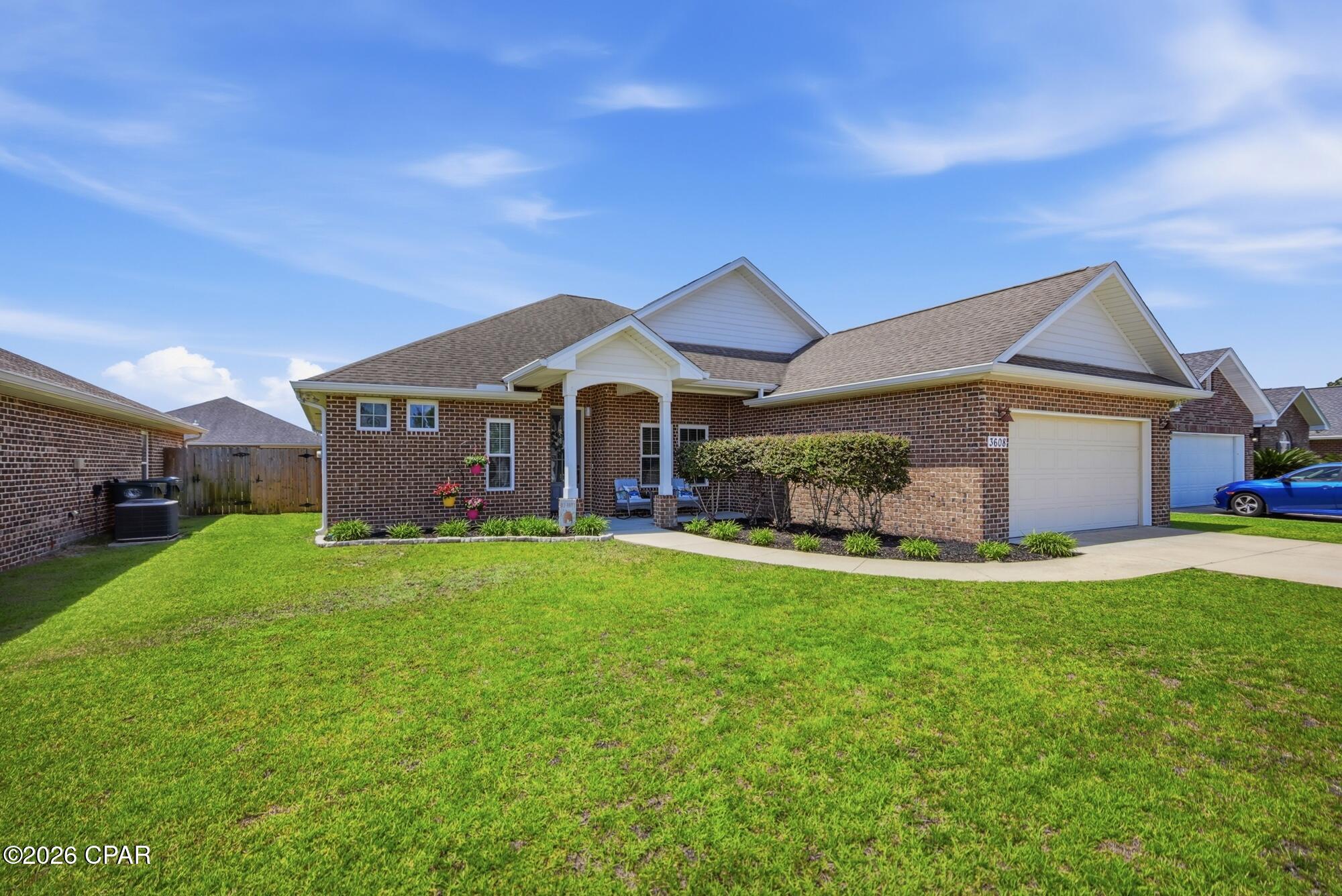 Meticulously Maintained, Move-In Ready Custom-Built Home! Prepare to be impressed by all the exceptional features this beautiful custom-built home has to offer! Designed with a desirable split floor plan, this home offers 3 spacious bedrooms plus a large flex room that could easily serve as a 4th bedroom, home office, playroom, or hobby space. The versatile flex room also features a large closet. The expansive 18' x 20' living room is warm and inviting, showcasing a beautiful gas fireplace, custom built-in cabinetry, and plenty of room for entertaining. The chef's kitchen is sure to impress with custom hardwood cabinetry, granite countertops, a farmhouse sink, all stainless steel appliances, a spacious pantry, an oversized kitchen island with breakfast bar, and a large dining area perfect for gatherings. The impressive primary suite features a high tray ceiling and double barn doors leading into the luxurious primary bath, complete with a double vanity, large walk-in shower, linen closet, and an oversized walk-in closet. The additional bedrooms are generously sized and share a spacious full bathroom. The laundry room offers added convenience with built-in storage cabinets and a deep utility sink. Step outside to enjoy the large 10' x 21' covered back porch overlooking a fully privacy-fenced backyard--ideal for relaxing or entertaining; there is even a stone paver Firepit. The spacious two-car garage includes pull-down attic stairs for additional storage, and the home is equipped with an automatic irrigation system. Additional upgrades include elegant wood-look tile flooring throughout the main living areas, carpet in the bedrooms, a cozy gas fireplace, and a Rinnai gas tankless water heater--so you'll never run out of hot water! The HOA is only $500 per year! Conveniently located in the heart of the area, this home offers easy access to schools, churches, major shopping, two local hospitals, Tyndall Air Force Base, Naval Support Activity Panama City, Haney Technical College, Florida State University Panama City, and Gulf Coast State College. All measurements were taken from the builder's plans. Buyer should verify all measurements if important.