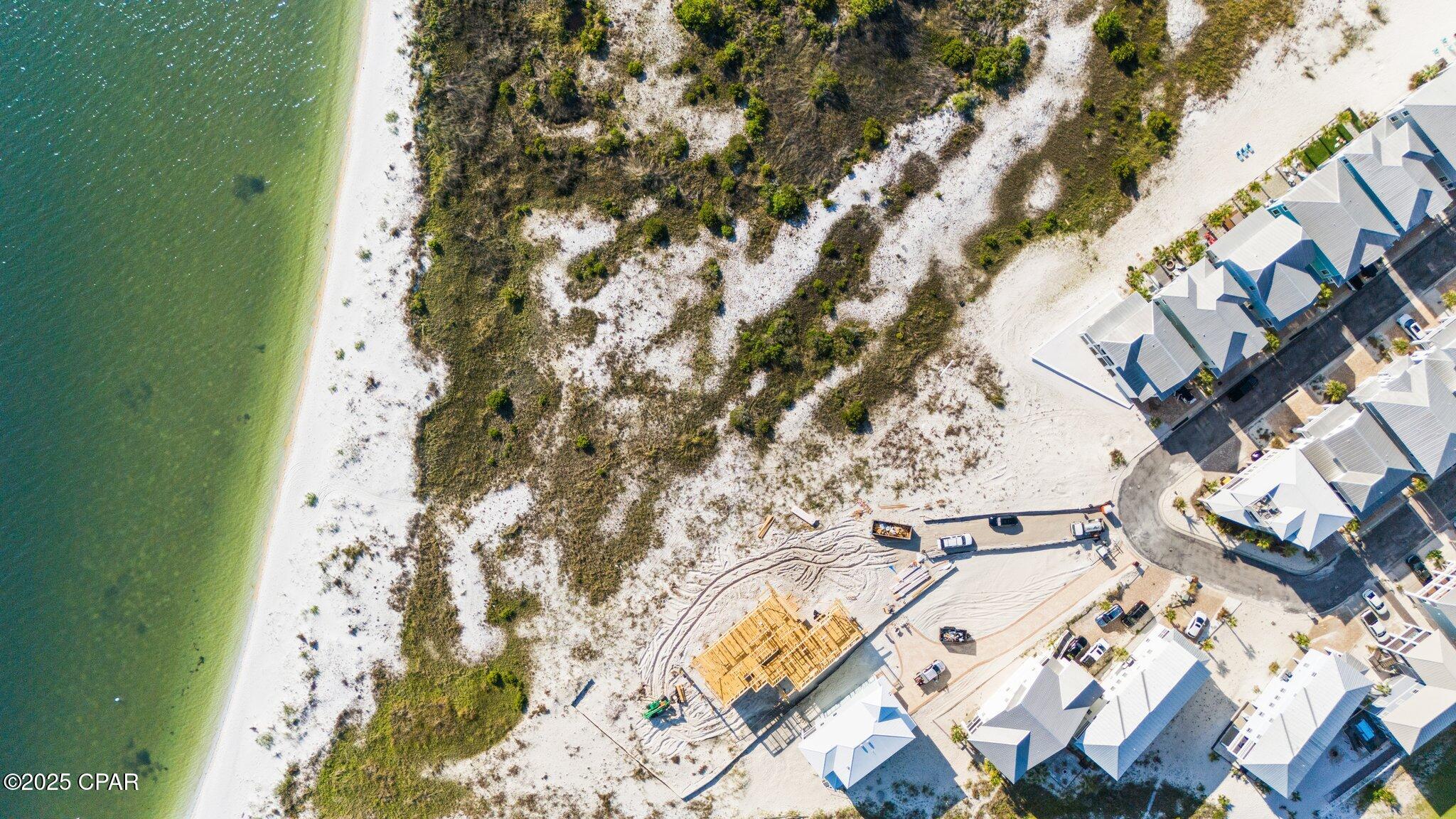 Vacant residential lot with white sand water view, ready for your new build!  Deeded beach access in the exclusive coastal subdivision of By The Sea.  Close to the Sound and the Gulf with fabulous views of each!  Community has 458 ft of shoreline along Santa Rosa Sound and is located between 80 acres of Santa Rosa County Park land and 8 miles of undeveloped federally protected Gulf Islands National Seashore.  By the Sea residences architecturally restricted with design in the style of Seaside and Rosemary Beach in Destin.  Sea turtle friendly lighting, brick pavers, underground utilities, community pool, bathhouse, outdoor hot tub, fire pit grill and picnic areas, deeded beach access and community park access.