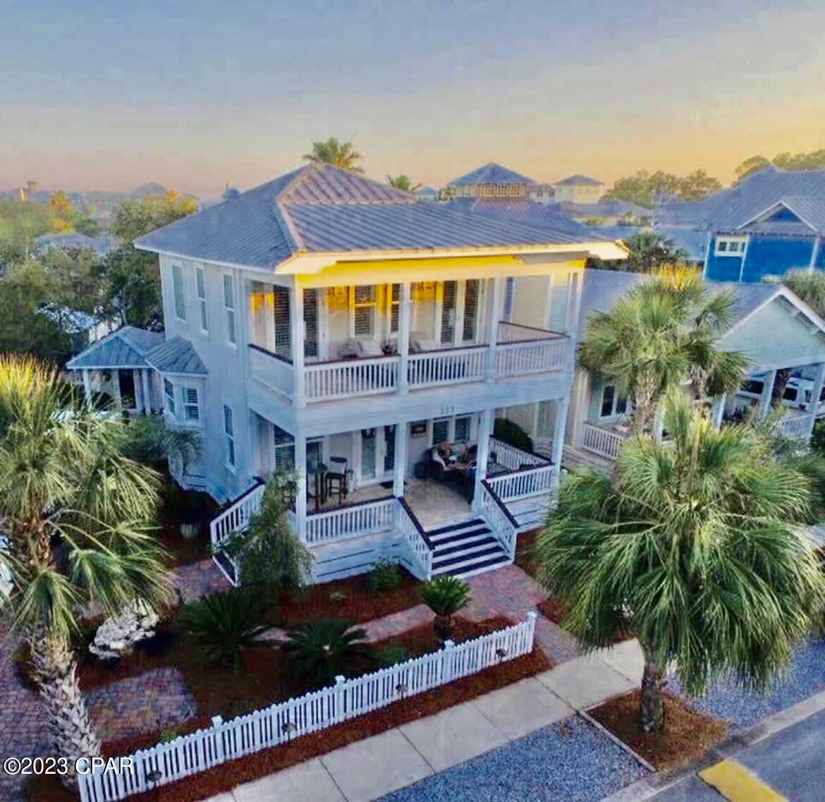 This perfect permanent home,  vacation home, or investment property, ''License to Chill'' has everything you could ask for. The 2 story, 3 bedroom, 3 full bath home with ''bonus'' bunk or extra bedroom is a jewel.  One bedroom and full bath are located on the 1st floor and the additional  bedrooms and baths are located on the 2nd floor along with the ''bonus'' room. Gracious double loaded porches across the front of the home on both  1st and 2nd floors are perfect for visiting and relaxing.  House is located across the street from Bellview Park  heated swimming pool, tennis courts, basketball court, and children's play area.  You will love cooking in the Professional Viking kitchen.  This home, a short walk to the beach, is being sold furnished and move-in ready.