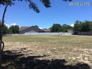 What a price for a lot with NO HOA fees but covenants.  City sewer and water available.  Cleared and ready to go!  Lots on either side available too.  Close to downtown, St. Andrew. Public Library and Government Building.