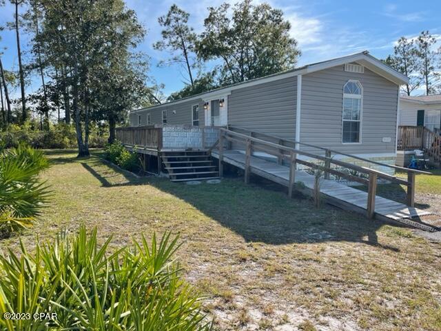 2bd 2ba mobile home, completely renovated with metal roofing, kitchen and bath upgrades, nautical textured walls, LVP flooring, recessed LED lighting, ceiling fans, cordless blinds and carpeted bedrooms. Huge patio deck overlooking tropical woods with a very private feel. Large kitchen area open to living room with plenty of cabinets, breakfast bar, with stainless-steel appliances included. Master bedroom is spacious with a full-length closet with private master bath that offers his and hers sinks, vanity station with additional shelfing throughout. Laundry room has matching Whirlpool washer and dryer with plenty of shelving. Large 8x10-ft shed with worktable in backyard! Garbage, landscaping, propane included.
Pet friendly -- 1 pet under 20-lbs w/ a $250 non-refundable pet fee.