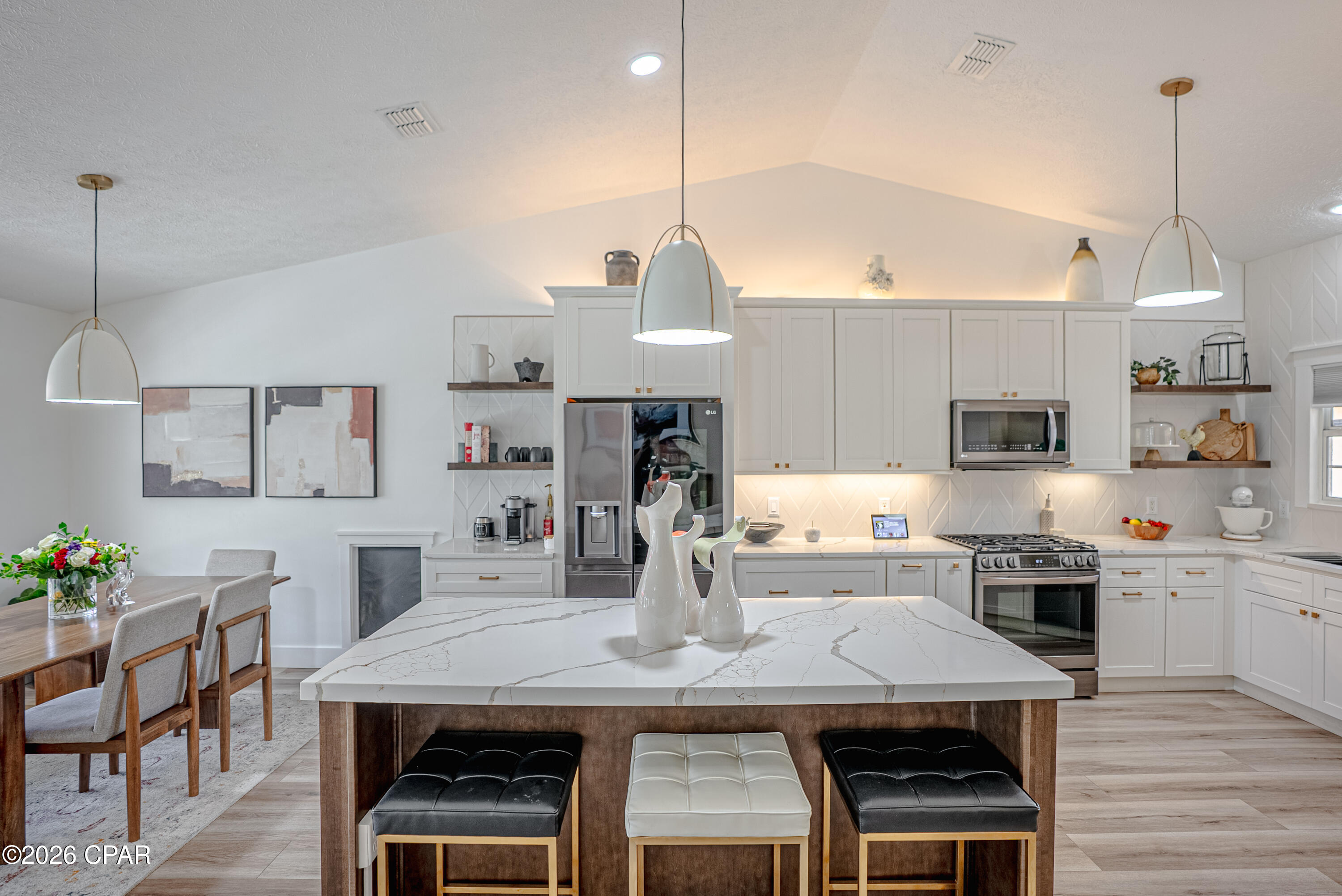 ** OPEN HOUSE SUN 3/29 11am -1pm** ''Paradise'' perfectly re-imagined: Welcome to 237 S Glades Trl. No expense was spared in elevating this stunning property into a masterpiece of modern sophistication. Featuring superior smart technology and unrivaled custom craftsmanship, this home offers a premier lifestyle in one of the most sought-after, easy-living communities in the area.''

The heart of the home is a showstopping chef's kitchen anchored by a custom Calcutta Gold quartz island with a dramatic 2-inch apron edge. Designed for the culinary enthusiast, the space features bespoke cabinetry with double trash pulls, an extra-large spice cabinet, and dual utensil pull-outs. This is one of the rare homes in the neighborhood equipped with a gas stove, complemented by a full suite of LG ThinQ WiFi-enabled black stainless appliances, including a counter-depth refrigerator with a dual craft ice dispenser. A commercial-style black stainless and gold faucet serves a workstation sink complete with a built-in cutting board and drying rack.
The interior is finished in durable Benjamin Moore Scuff-X paint and integrated with seamless smart technology. Every light in the home is Alexa or Google-compatible, and the master suite features custom motorized blinds. Custom hallway built-ins provide elegant hidden storage, while the laundry zone includes a built-in washer and dryer that stay with the home. Outside, you will find a large driveway and 2-car garage as well as permanent GoVee lighting that offers year-round festive curb appeal, while the screened-in porch and extended patio overlook a tranquil neighborhood pond.
The location is truly unbeatable in terms of accessibility. Enjoy unmatched convenience with three neighborhood entrances that lead directly to Hutchison Blvd, R Jackson Blvd, and Hwy 98, placing you just 0.4 miles from the white sandy beaches. You are minutes away from premier shopping at Pier Park, and daily essentials like Publix, Home Depot, Walmart, as well as the area's best dining and entertainment, including the Duplin Winery located at the main entrance of the neighborhood. 
This move-in-ready retreat offers the perfect blend of a quiet, established neighborhood and the luxury of a custom new build. Please call your agent for a showing today!