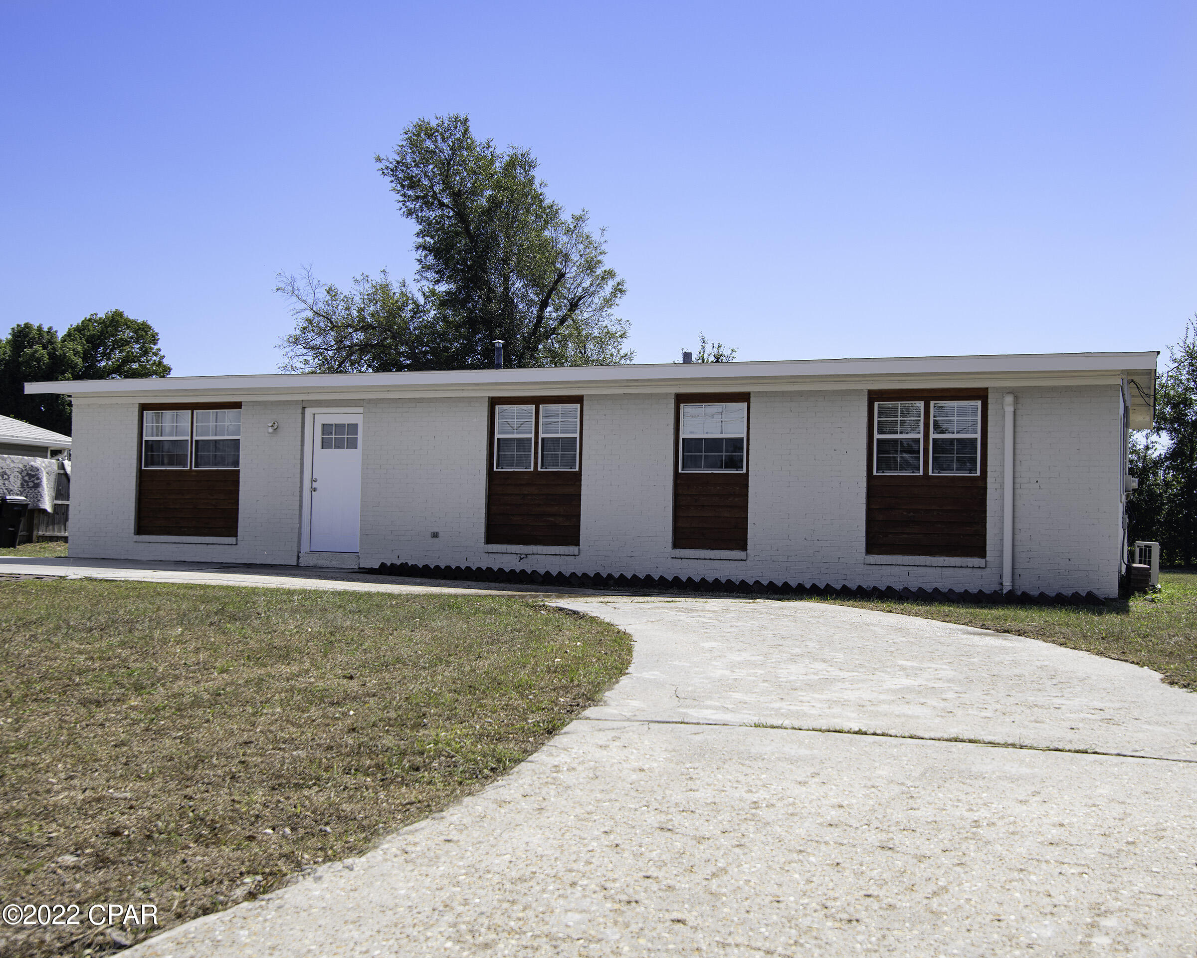 *CURRENTLY UNDER CONTRACT, SELLER WILL CONSIDER BACK UP OFFERS.  Great opportunity to get a solid block house, redone post hurricane, at a great price.  More than a quarter acre of ground makes for a roomy yard.  Perfect as a starter or a downsizer house.  Nice, quiet neighborhood.  The following work was done in 2019: 

Roof installed with damaged tresses replaced, new drywall, new painting, water heater, new mini split system for economical zone heating and cooling, new kitchen appliances, upgraded kitchen cabinets, upgraded bathrooms, interior doors & windows painted.  Newer windows.  Large front concrete driveway would make for easy storage of many vehicles, a boat, RV or any of your toys.  Measures are very close, but some rounding has been used. Furnishings are negotiable if desired.