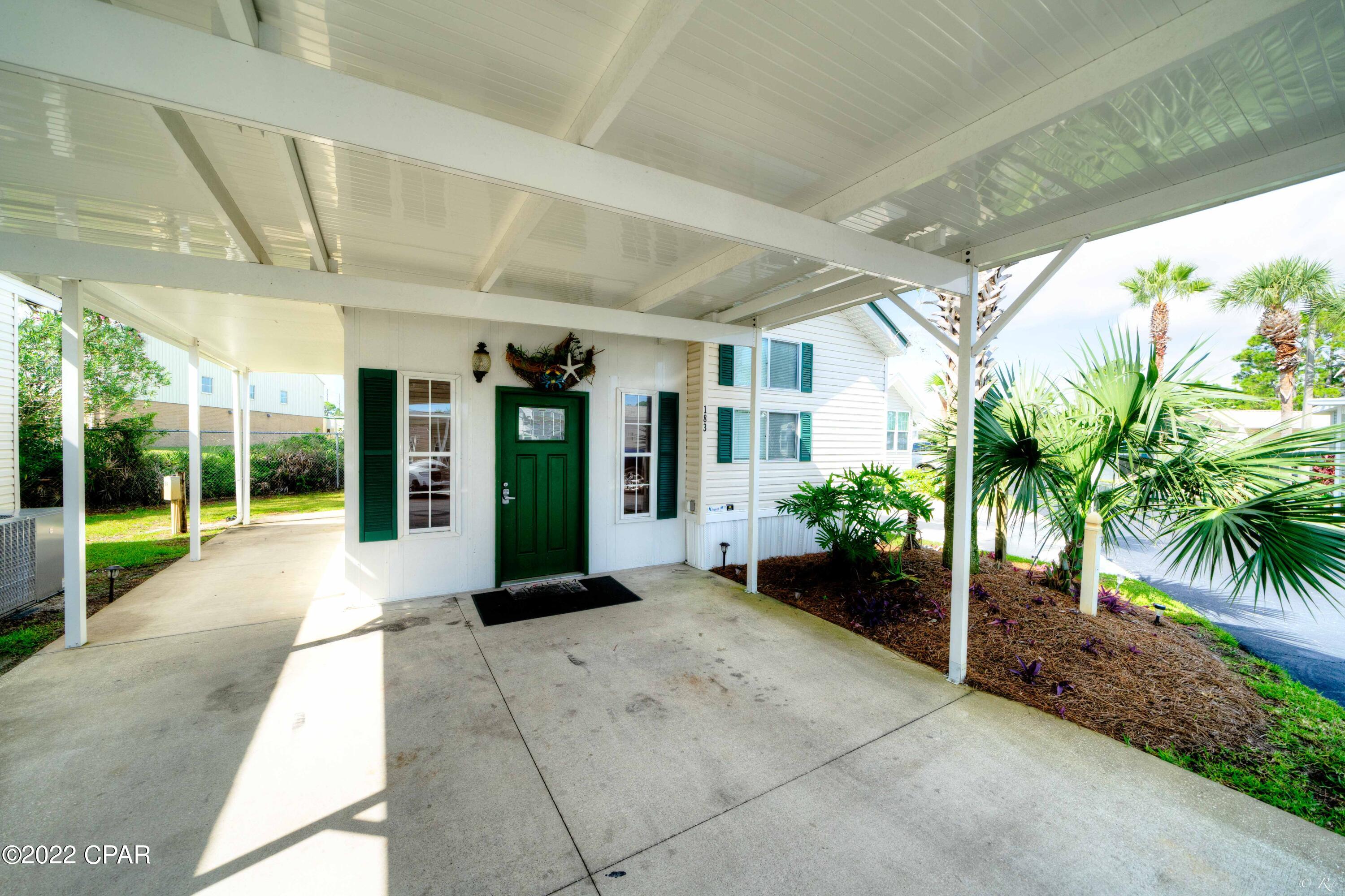 CURRENTLY UNDER CONTRACT, SELLER WILL CONSIDER BACKUP OFFERS - Make your appointment to see this this beautifully maintained, move in ready home located in the highly sought-after community of Emerald Pointe Resort. Whether you are in the market for a full-time residence, 2nd home, or investment property, this is the one for you! This 2 bedroom, 2 bath home features a bright open floorplan, 2 living areas, an open kitchen, a large walk-in laundry room / storage room that can be accessed from inside or outside, a covered carport with extra room to park oversized vehicles, and a covered side patio for your enjoyment. The living room addition, carport, side patio and roof were added in 2019, and in 2020, updates include LVP FLOORING throughout, newer paint, kitchen sink, and its being-Cont... sold fully furnished. Emerald Pointe Resort is a gated community located in the heart of Panama City Beach close to restaurants, shopping, and the world's most beautiful beaches. Amenities include a large clubhouse, exercise room, 2 pools (one heated seasonally), hot tub, lake with boardwalk, and shuffleboard court. HOA fee includes water, sewer, garbage, cable, and lawn service. All information is approximate and should be verified by buyer if important.